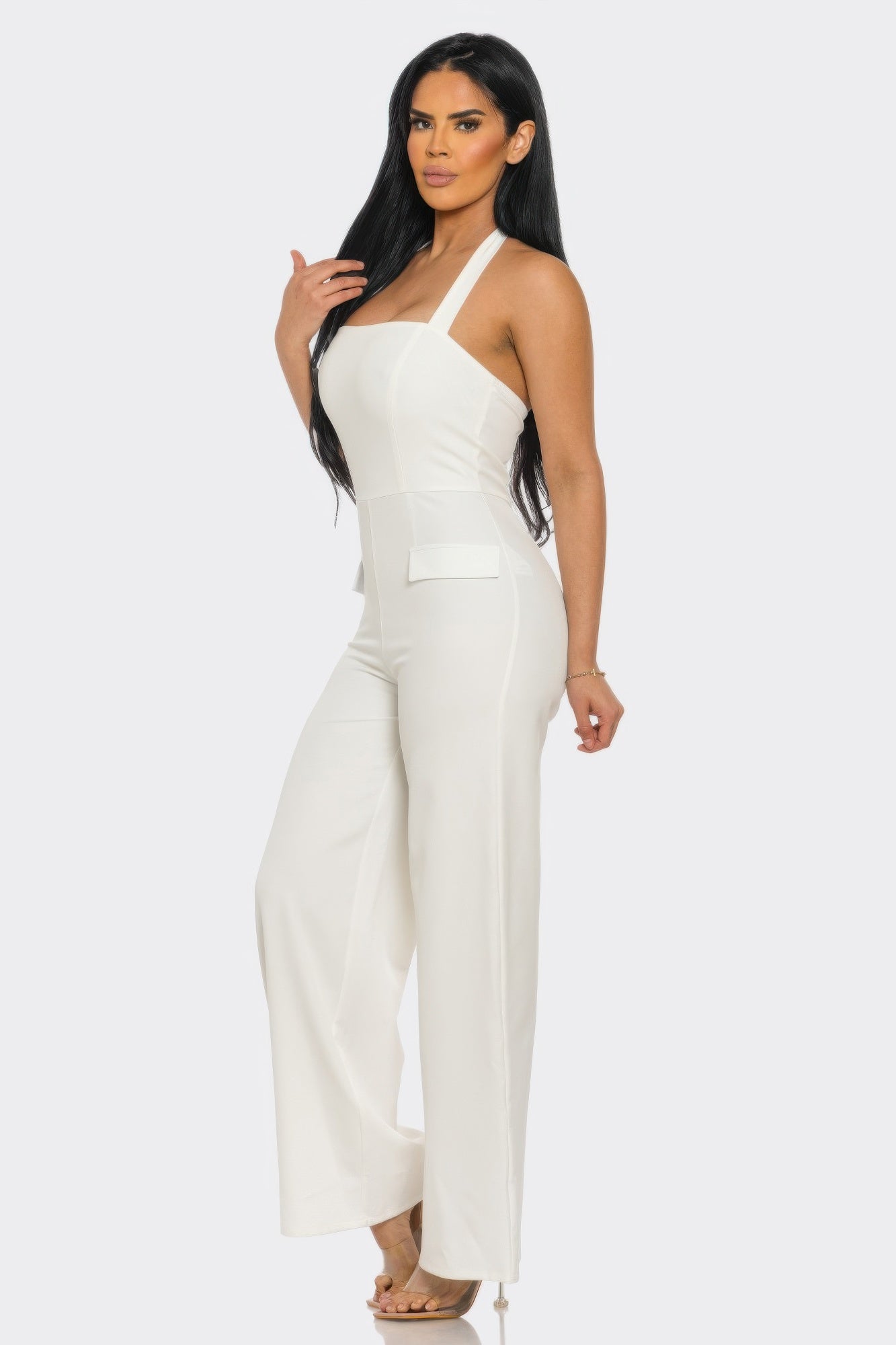 Black halter neck jumpsuit with back zipper from Toshe Women's Fashions, featuring a stylish sleeveless design and fitted silhouette.