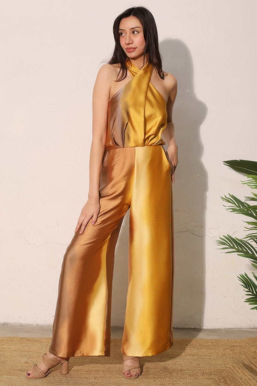 Ombre satin-look convertible halter jumpsuit in stylish design, worn by a model, from Toshe Women's Fashions.