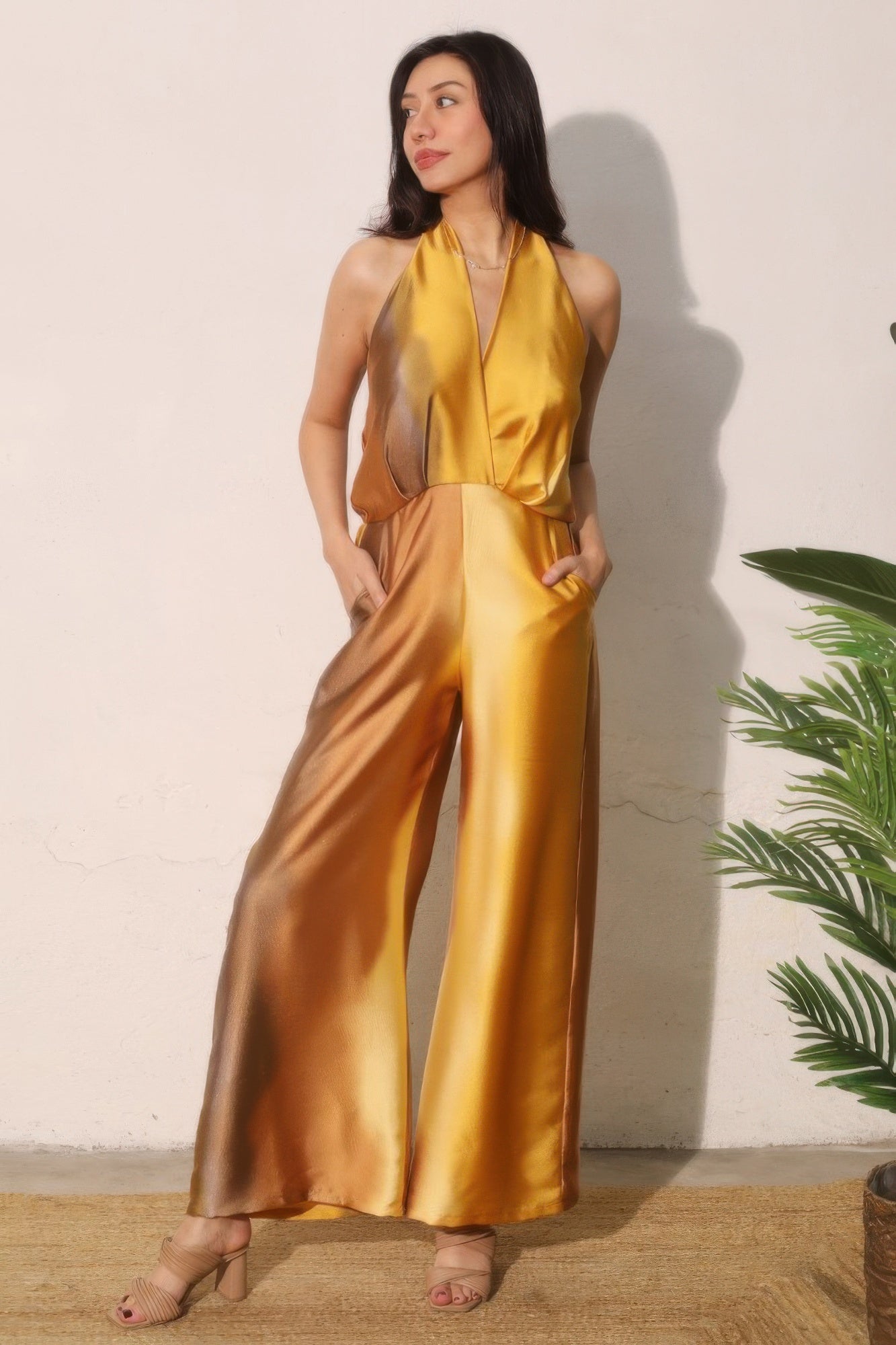 Ombre satin-look convertible halter jumpsuit in blue and white, styled with a halter neckline and wide-leg pants.