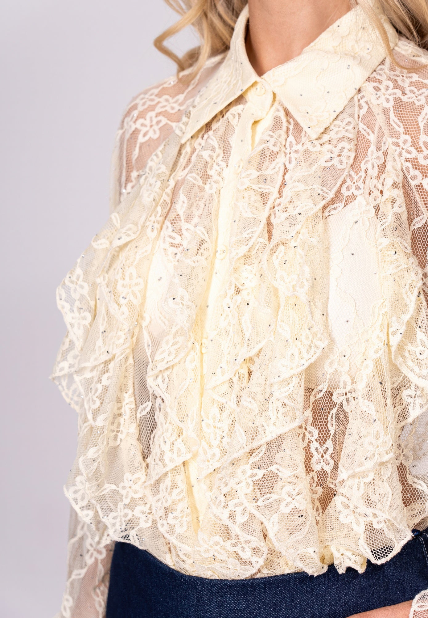 Lace ruffle hemmed sleeve blouse in soft fabric, featuring delicate detailing and a feminine fit, styled by Toshe Women's Fashions.