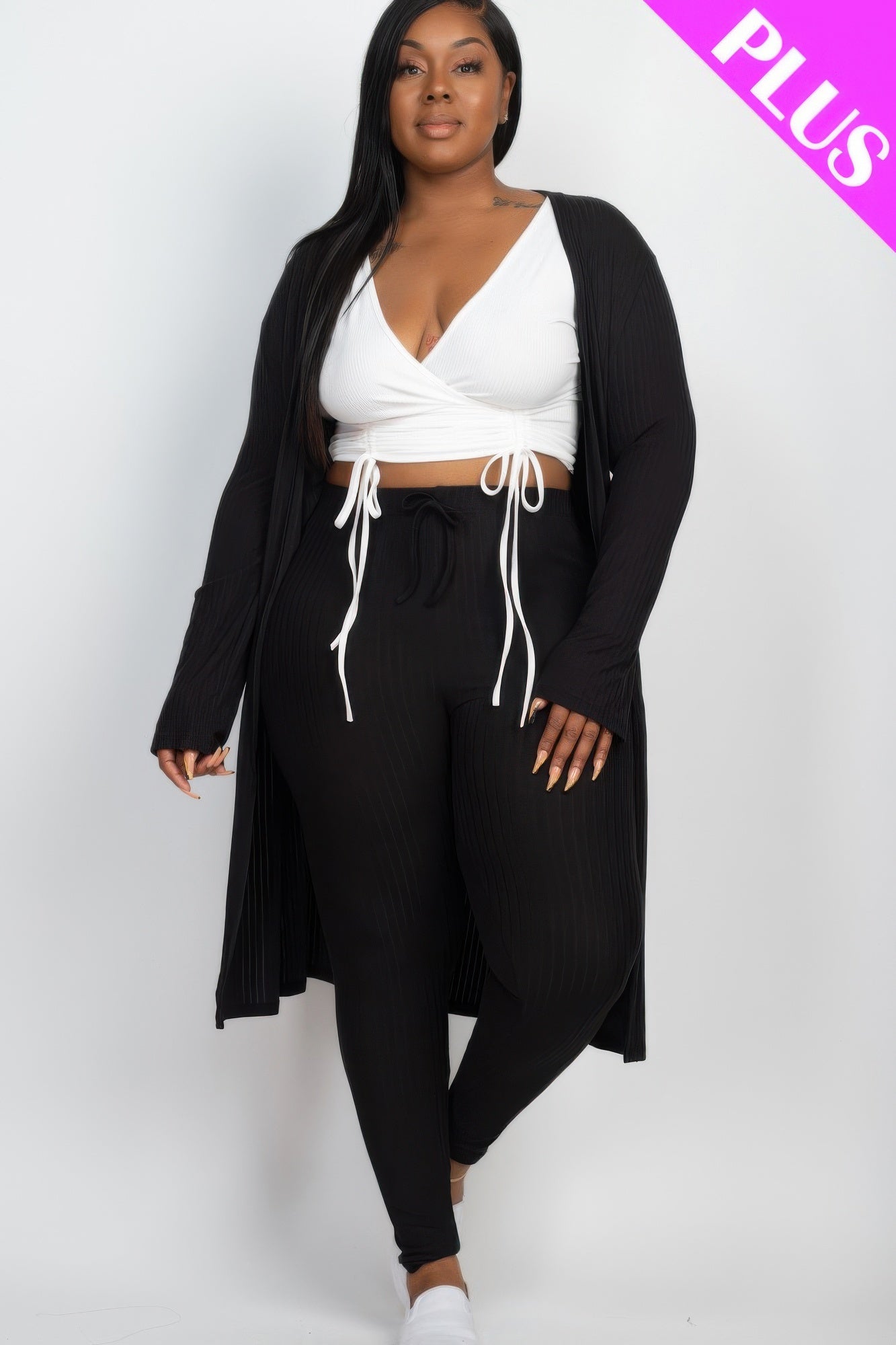 Ribbed long cardigan and matching leggings set by Toshe Women's Fashions, soft knit fabric, neutral color, styled for casual wear.