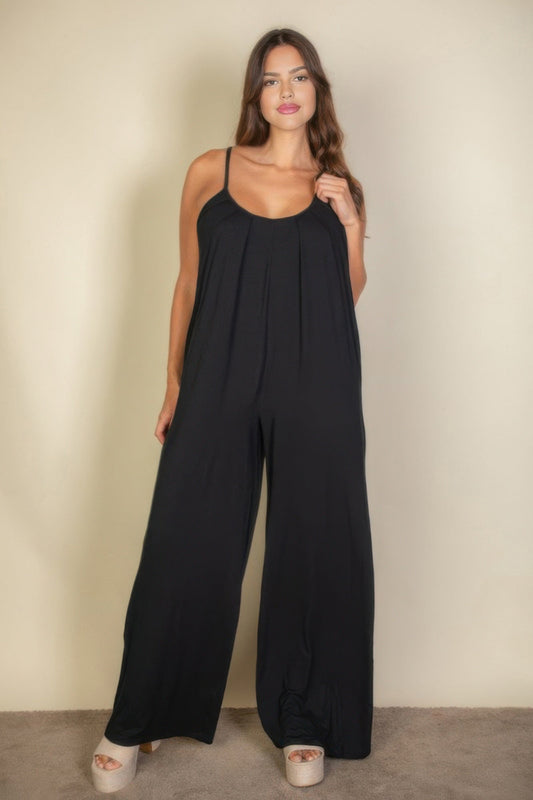Toshe Women's Fashions spaghetti strap solid wide-leg jumpsuit displayed on a hanger, showcasing its sleek design and flowy fabric.