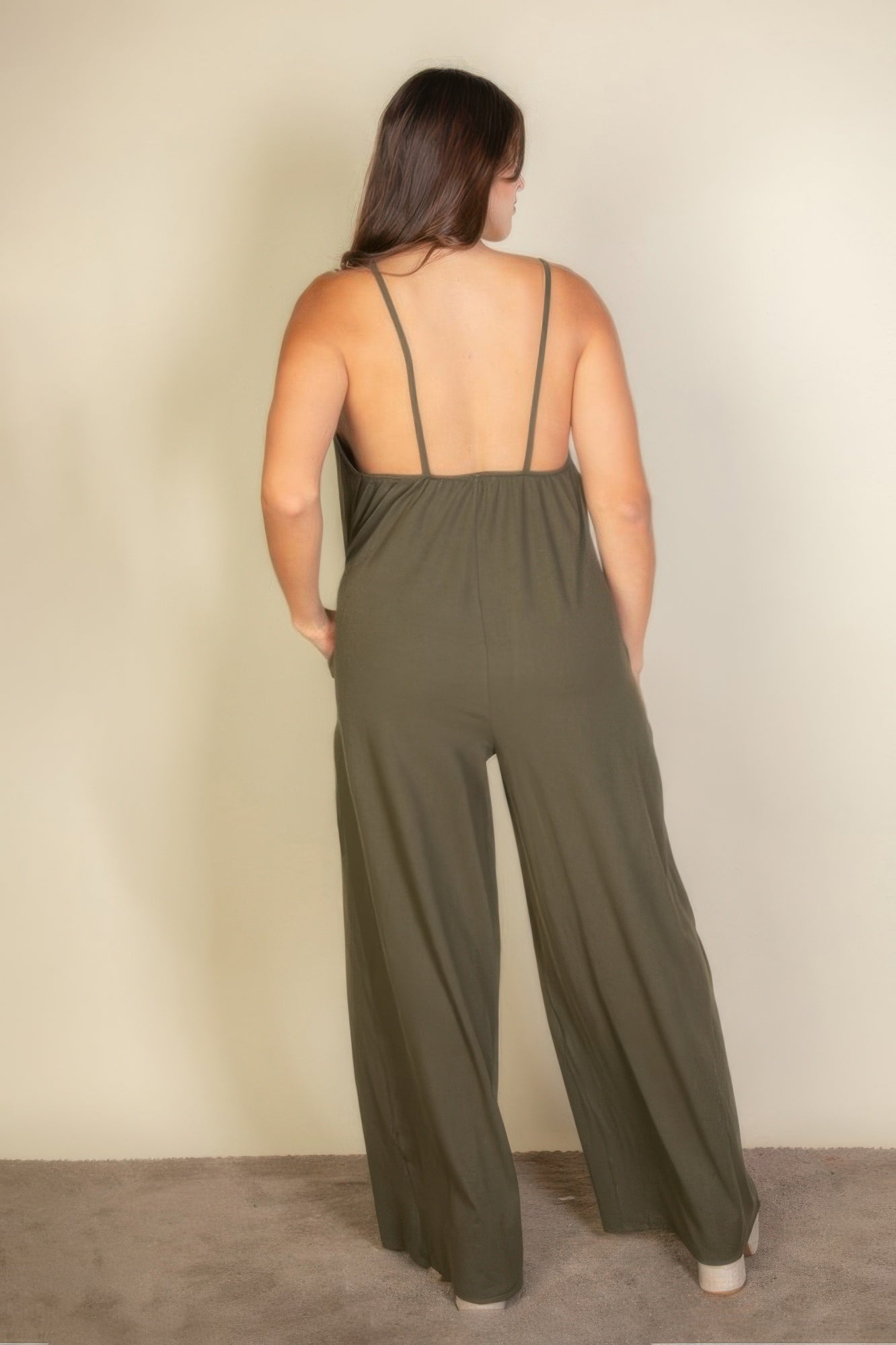Toshe Women's Fashions spaghetti strap solid wide-leg jumpsuit displayed on a mannequin, featuring a sleeveless design and relaxed fit.