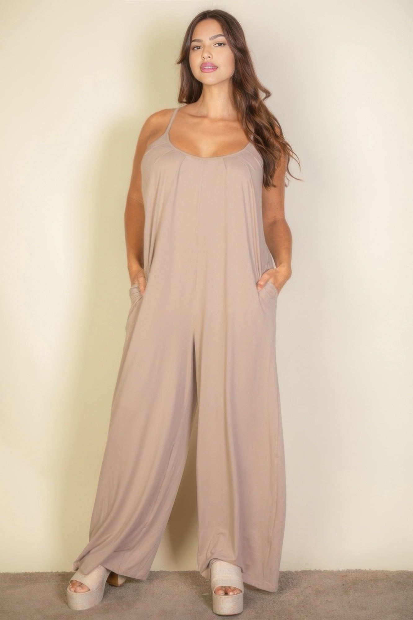 Toshe Women's Fashions spaghetti strap solid wide jumpsuit displayed on a hanger, featuring a sleeveless design and wide legs.