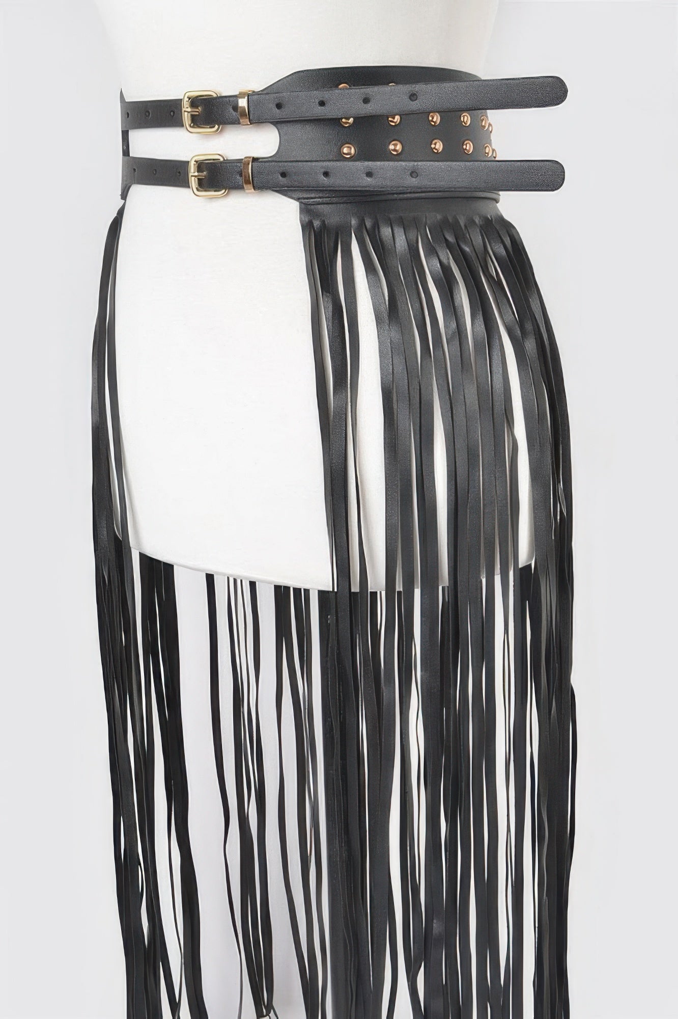 Faux leather fringe belt with metal studs, stylish accessory for women, featuring tassel details and adjustable fit.