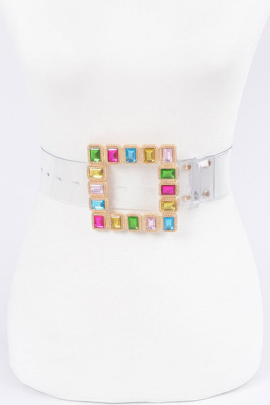 Transparent belt with stone buckle from Toshe Women's Fashions, featuring clear strap and decorative stone details.