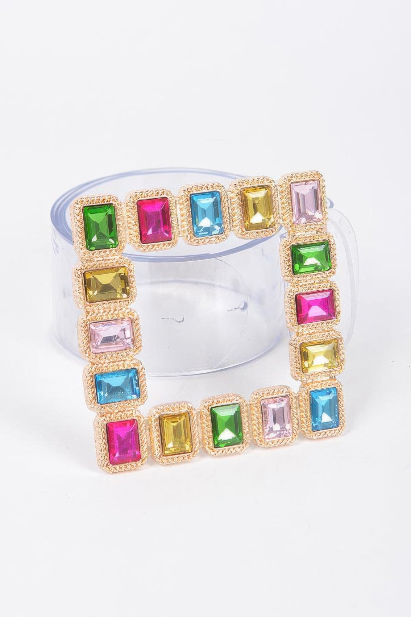 Transparent belt with stone buckle from Toshe Women's Fashions, showcasing a sleek and stylish accessory for various outfits.