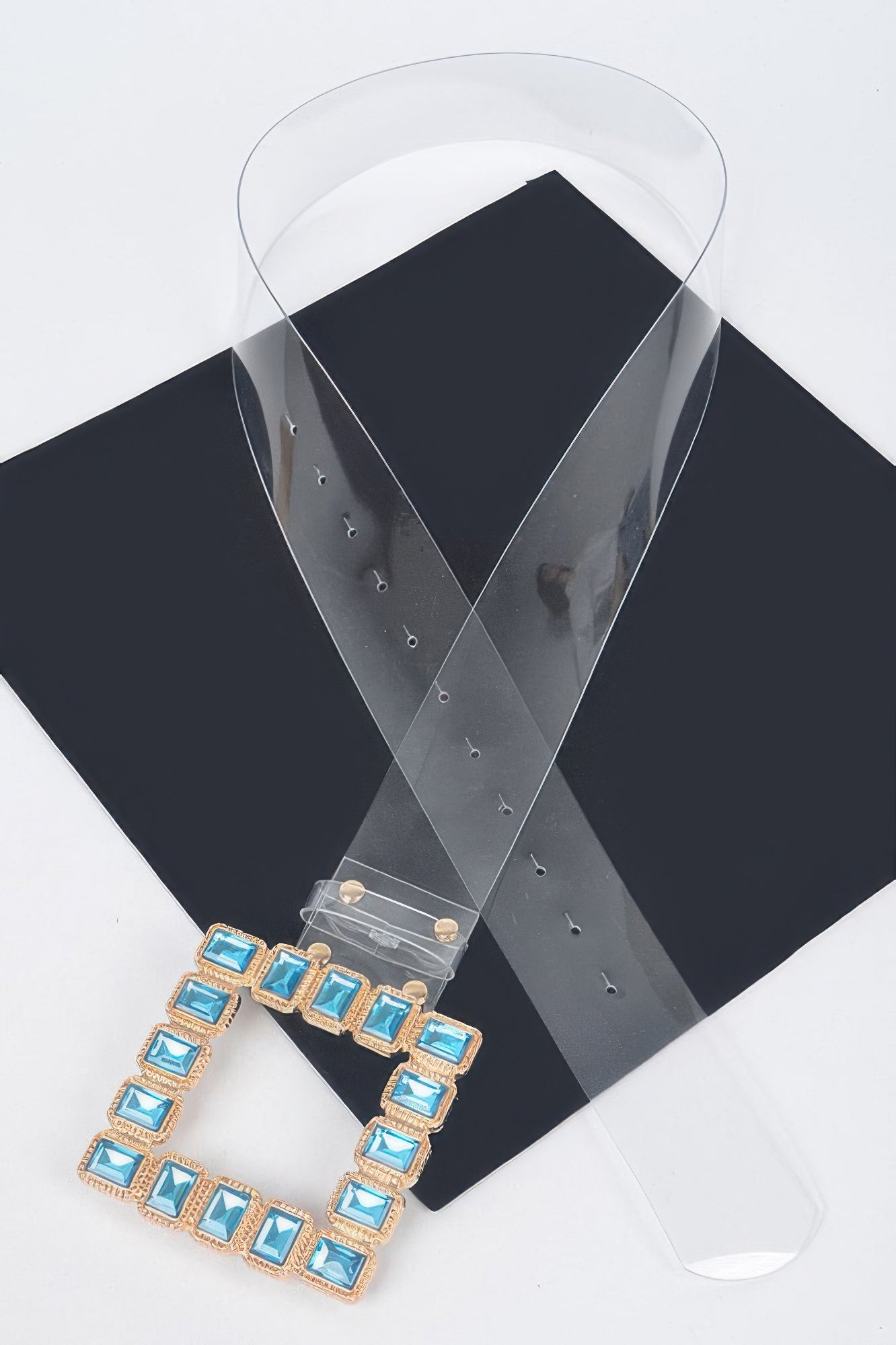 Faux leather belt with stone buckle from Toshe Women's Fashions, featuring a stylish stone-embellished buckle and sleek design.