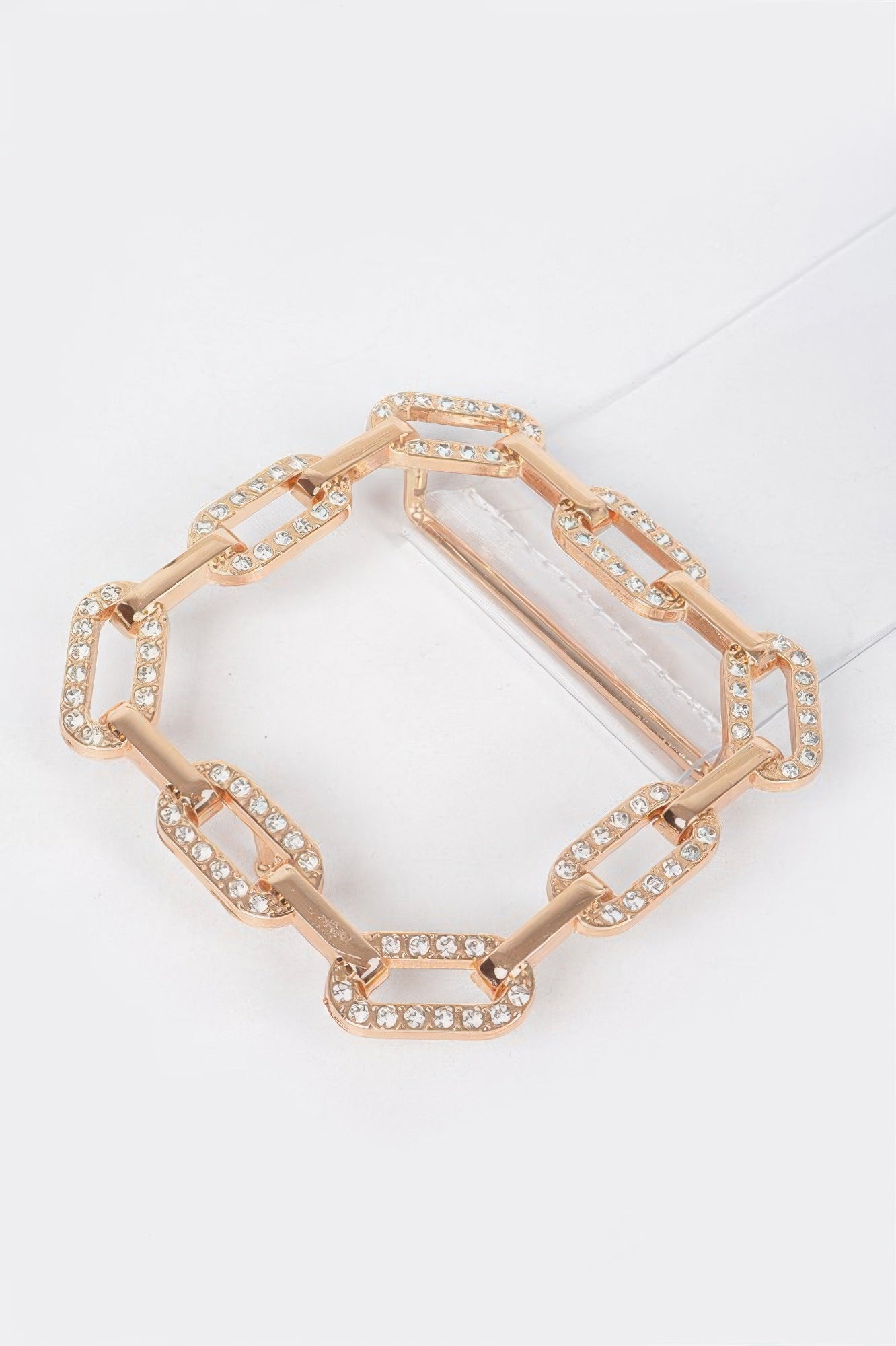 Transparent gold square buckle belt from Toshe Women's Fashions, showcasing a clear strap with a shiny gold buckle.