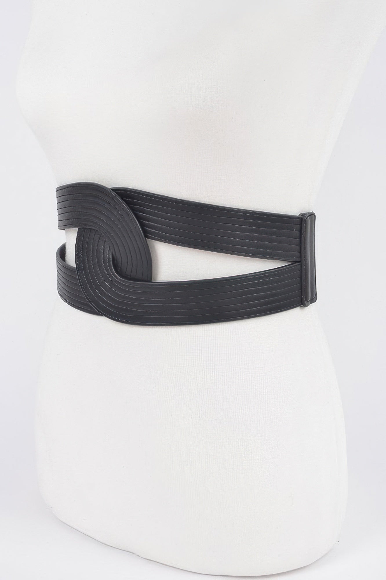 Faux leather elastic belt from Toshe Women's Fashions with adjustable fit and stylish design, shown in a close-up image.