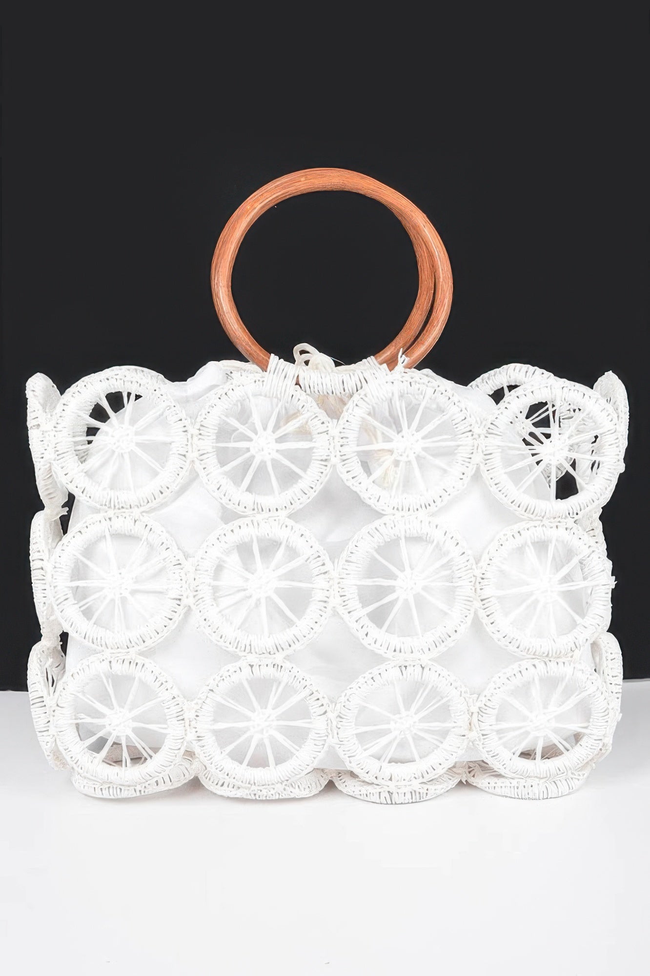 Monotone crochet handbag by Toshe Women's Fashions featuring a woven design and shoulder strap, stylish accessory for casual outfits.