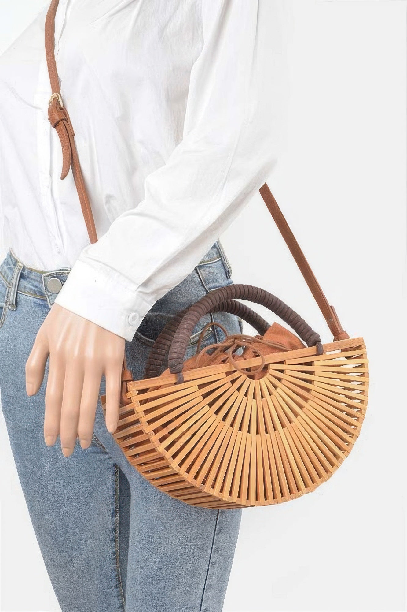 Handmade bamboo clutch bag with intricate woven design, stylish accessory by Toshe Women's Fashions.