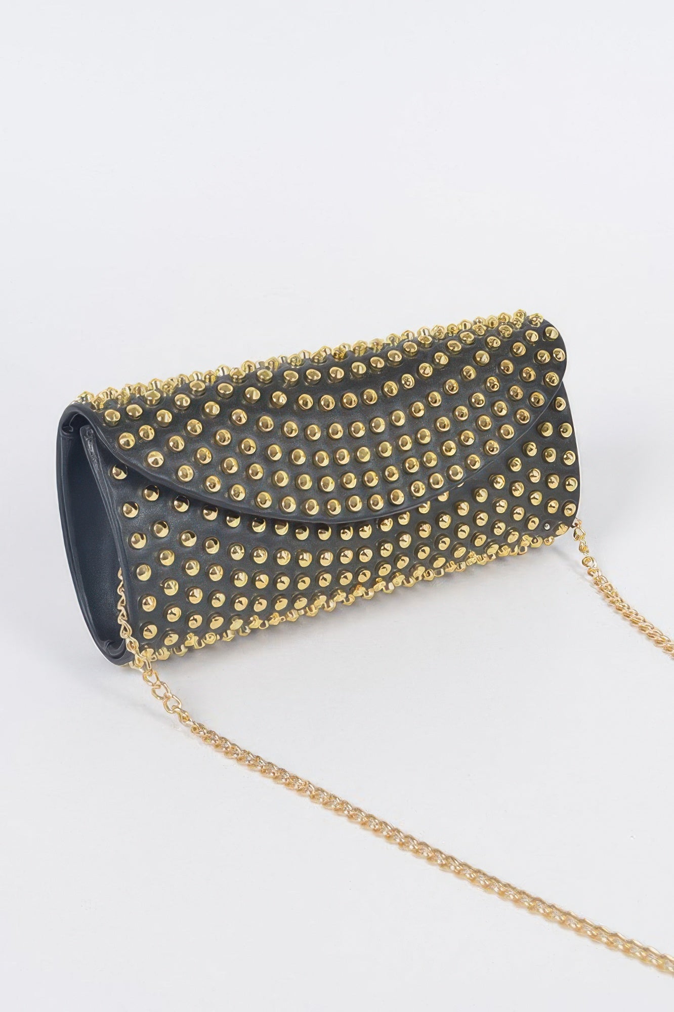 Black studded clutch bag by Toshe Women's Fashions with silver-tone hardware and textured surface.