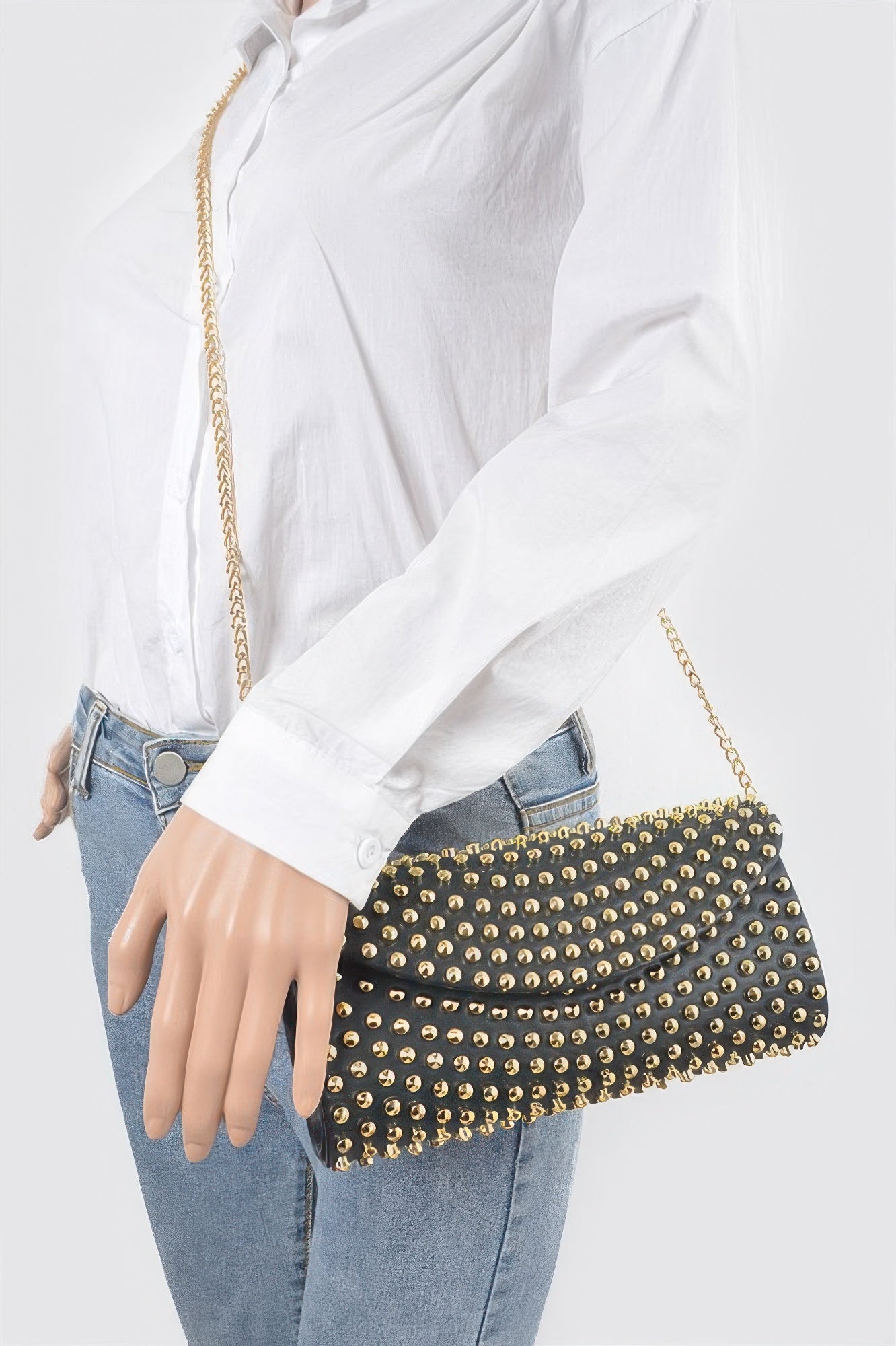 Black studded clutch purse from Toshe Women's Fashions with silver hardware and a sleek, modern design.