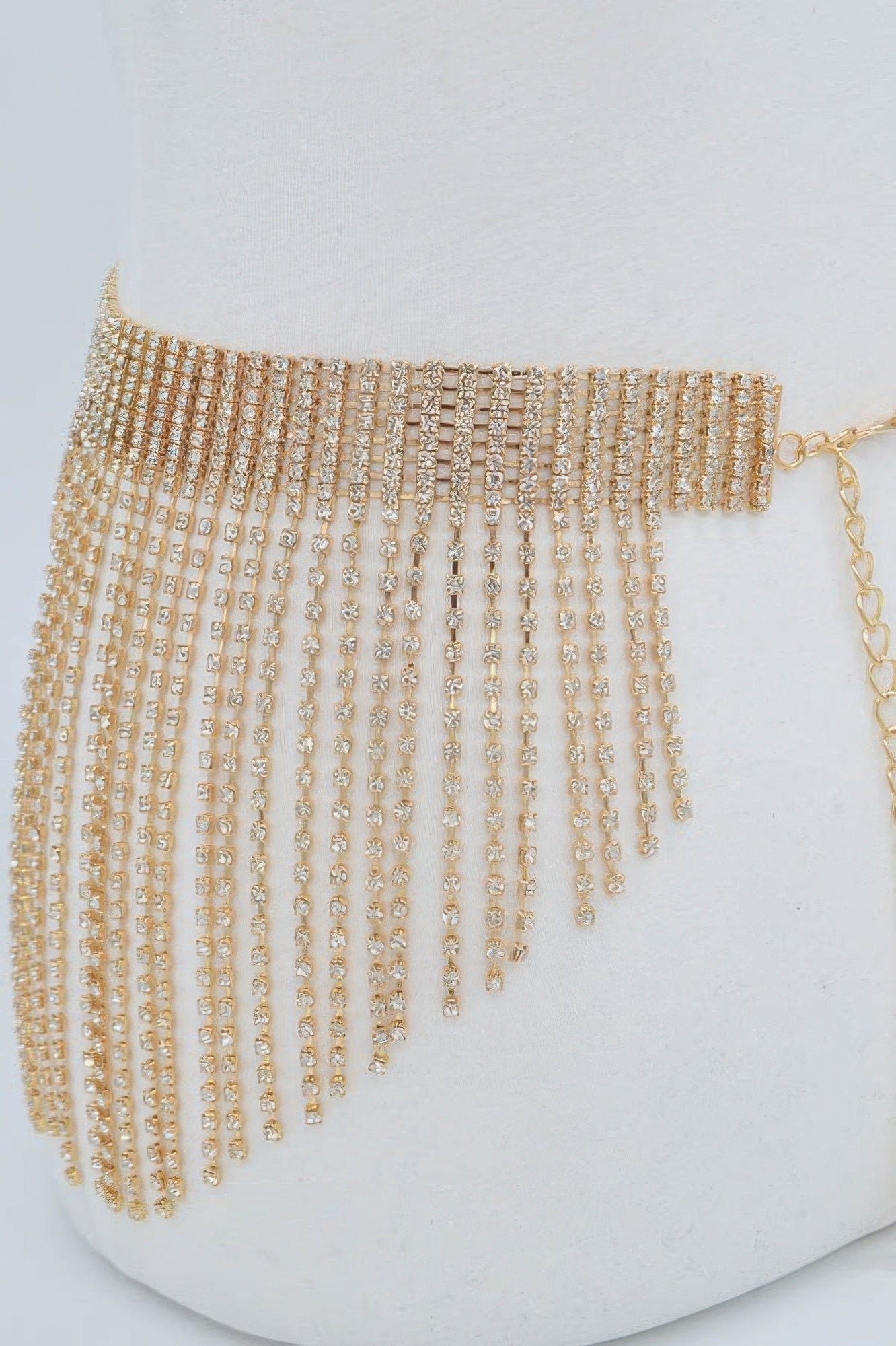 Multi-layered drop belt with rhinestones, featuring sparkling embellishments and a stylish design from Toshe Women's Fashions.