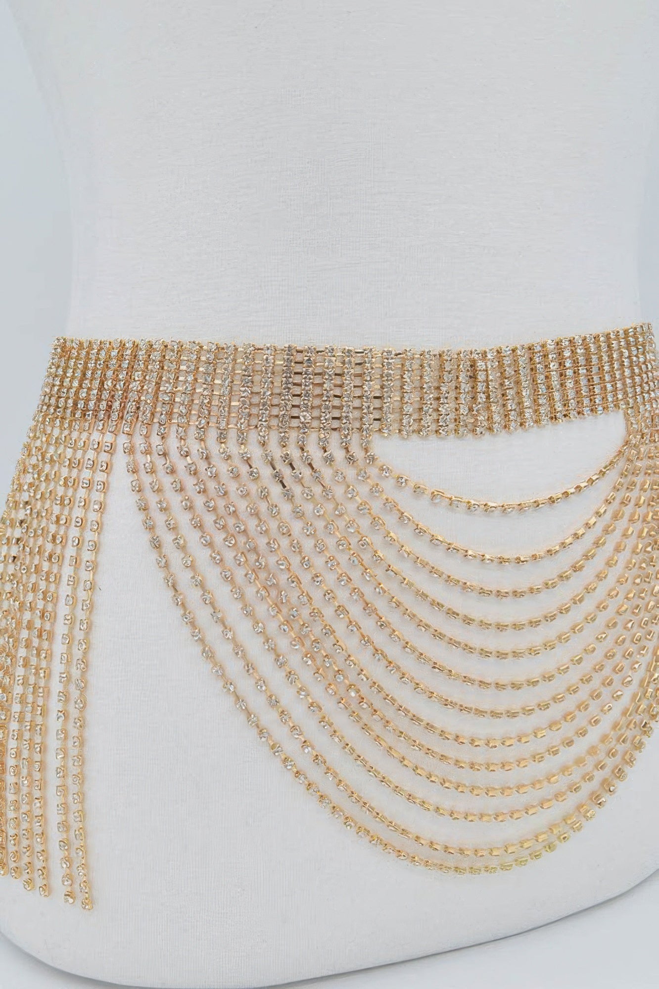 Multilayered rhinestone drop belt from Toshe Women's Fashions featuring sparkling rhinestones and layered design.