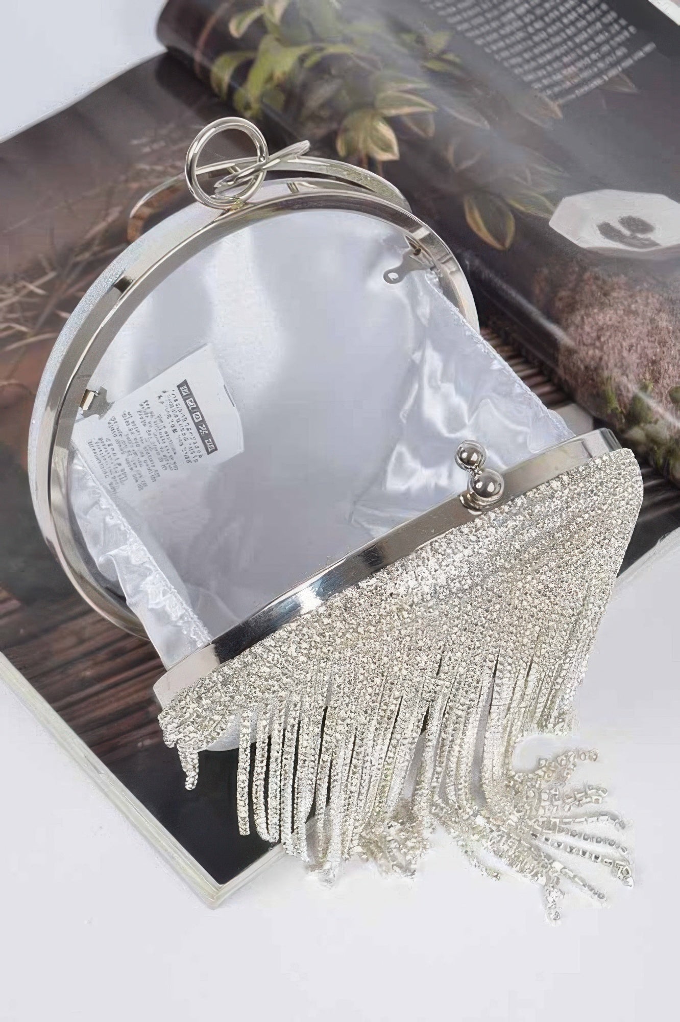 Rhinestone fringe round party bag by Toshe Women's Fashions with sparkling embellishments and a sleek circular shape.