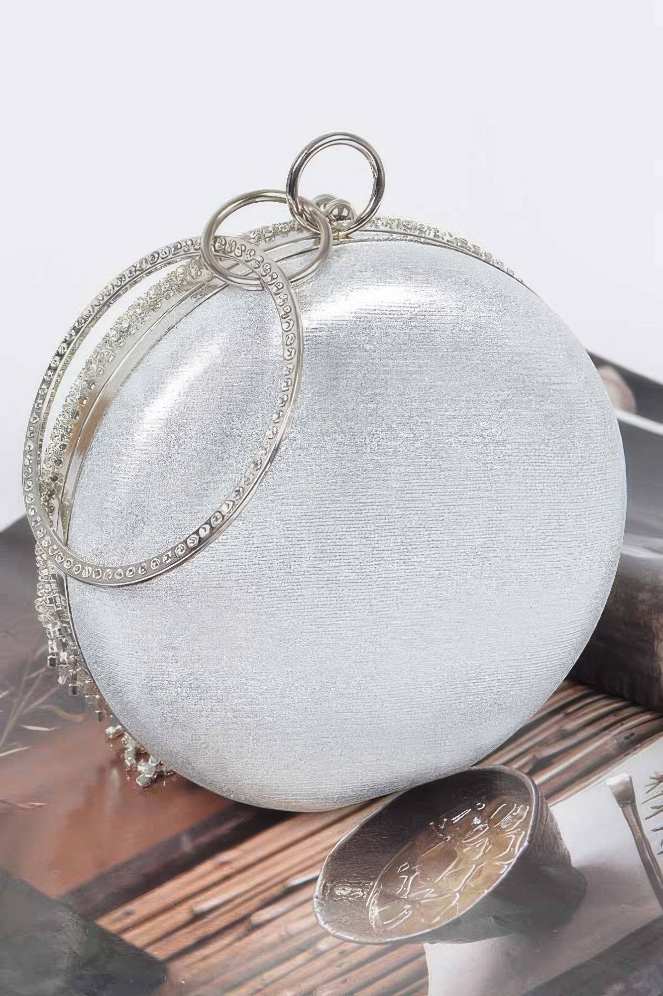 Rhinestone fringe round party bag with sparkling embellishments, designed by Toshe Women's Fashions for stylish evening occasions.