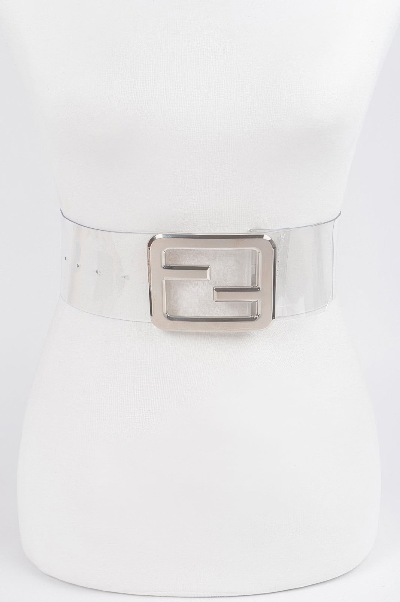 Clear belt with a metal buckle from Toshe Women's Fashions, showing the sleek, transparent strap and shiny silver buckle.