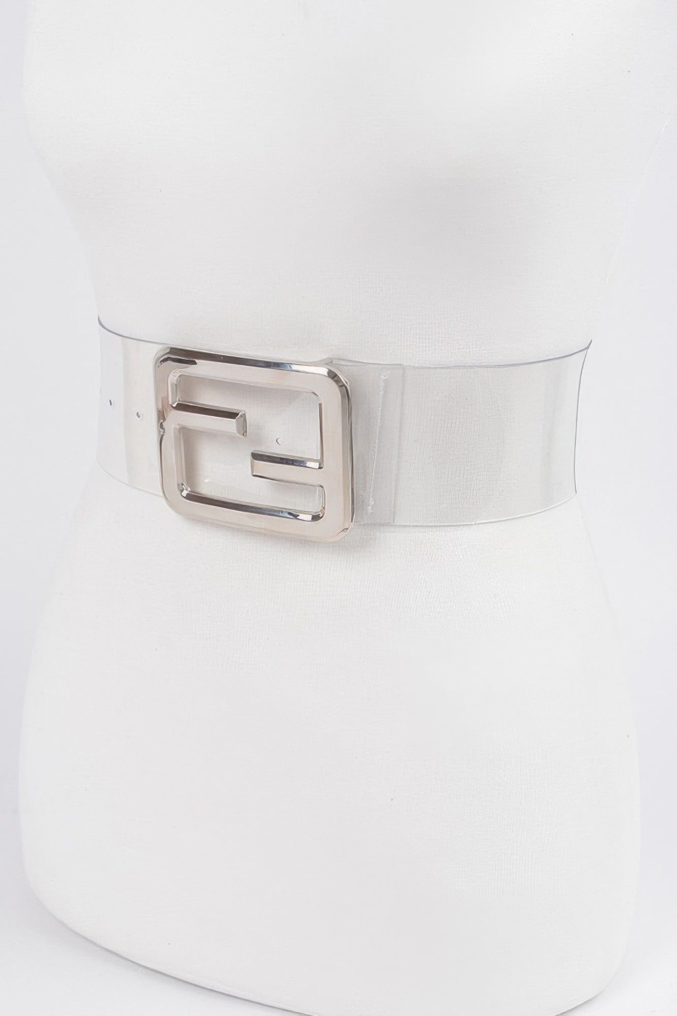 Clear belt with metal buckle from Toshe Women's Fashions, featuring a transparent strap and sleek metal buckle detail.