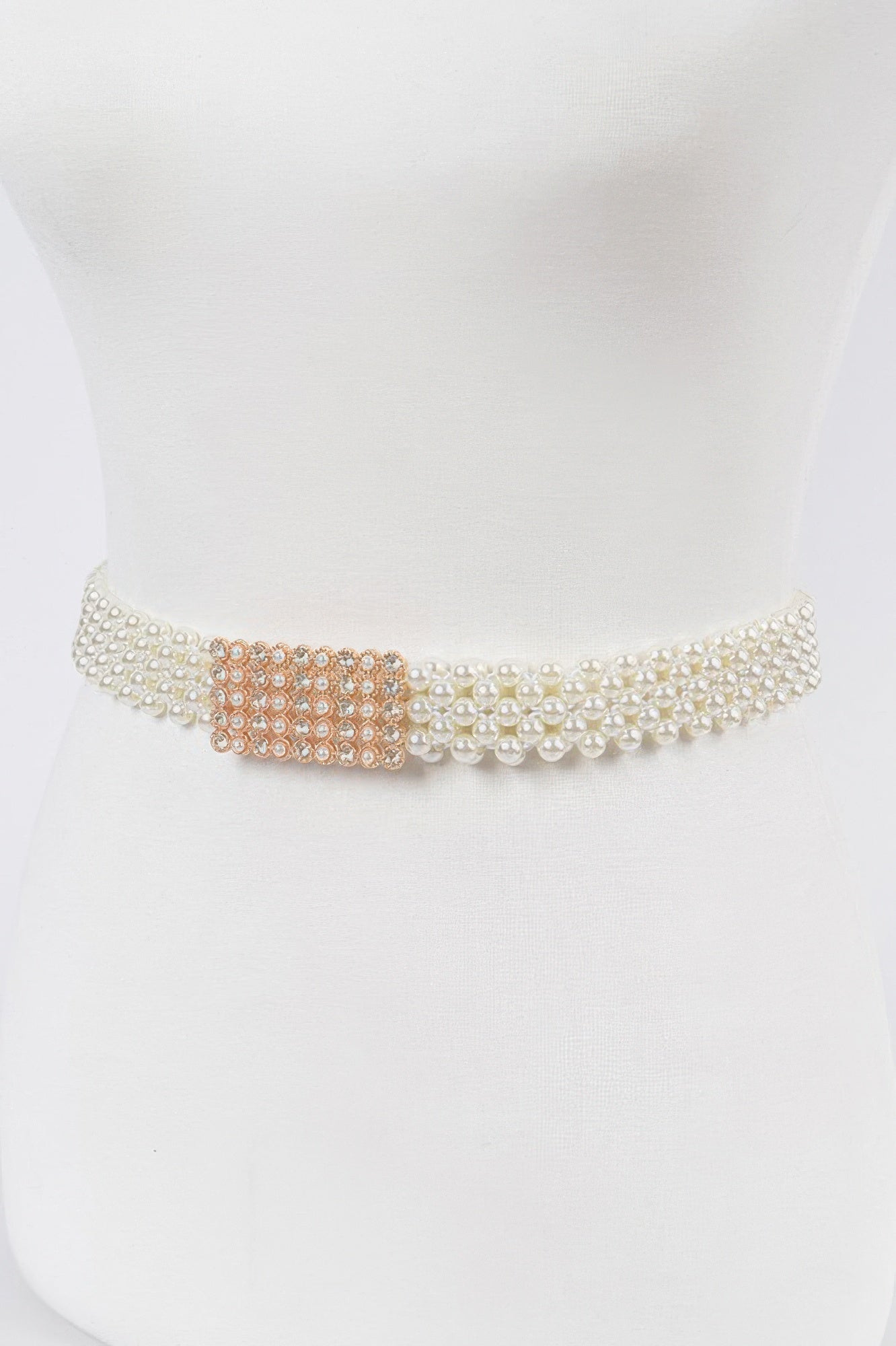 Elastic pearl belt from Toshe Women's Fashions featuring a stretchy band with pearl accents.