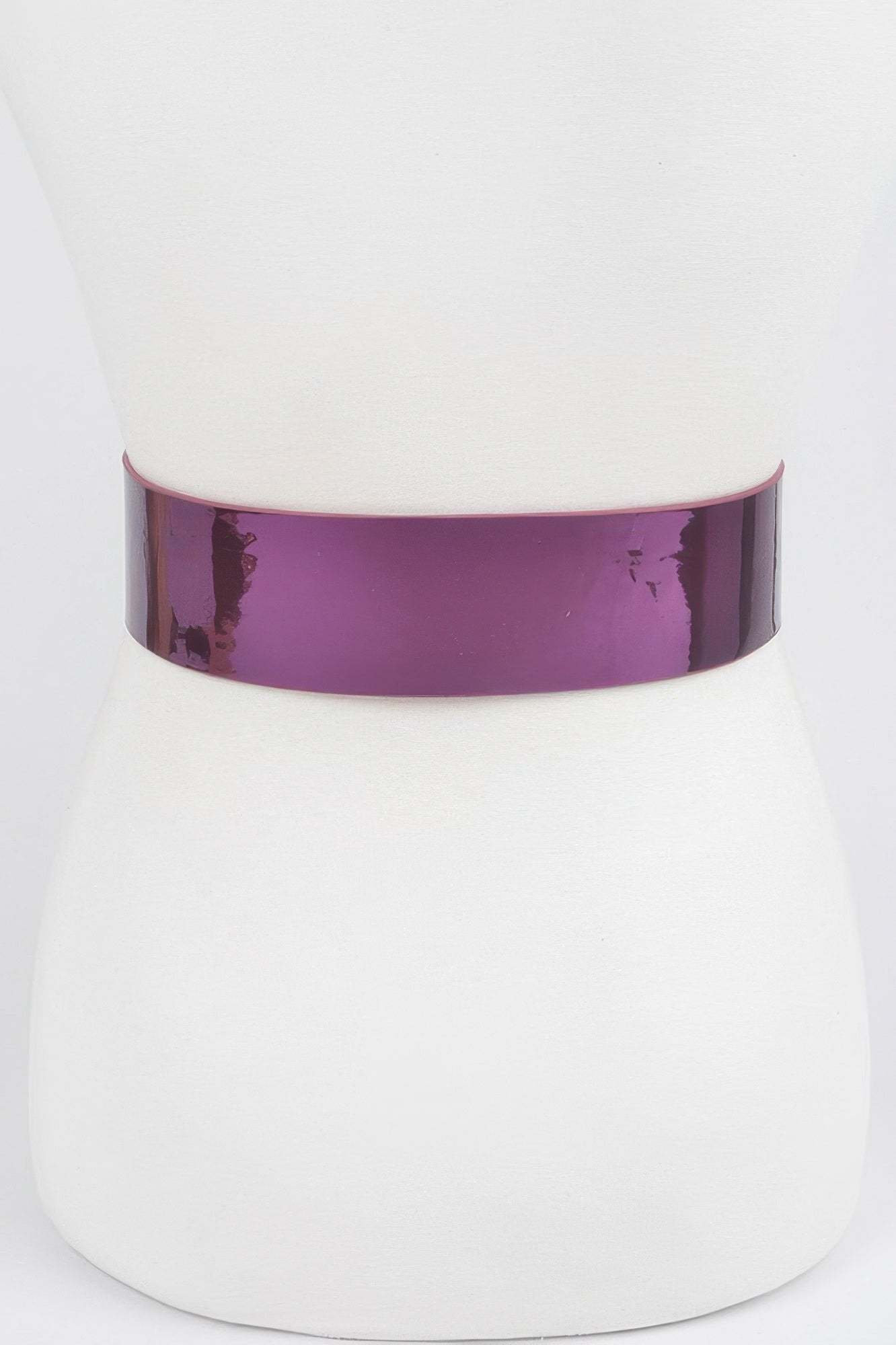 Metallic wide belt from Toshe Women's Fashions featuring a shiny, reflective finish and a sleek design.