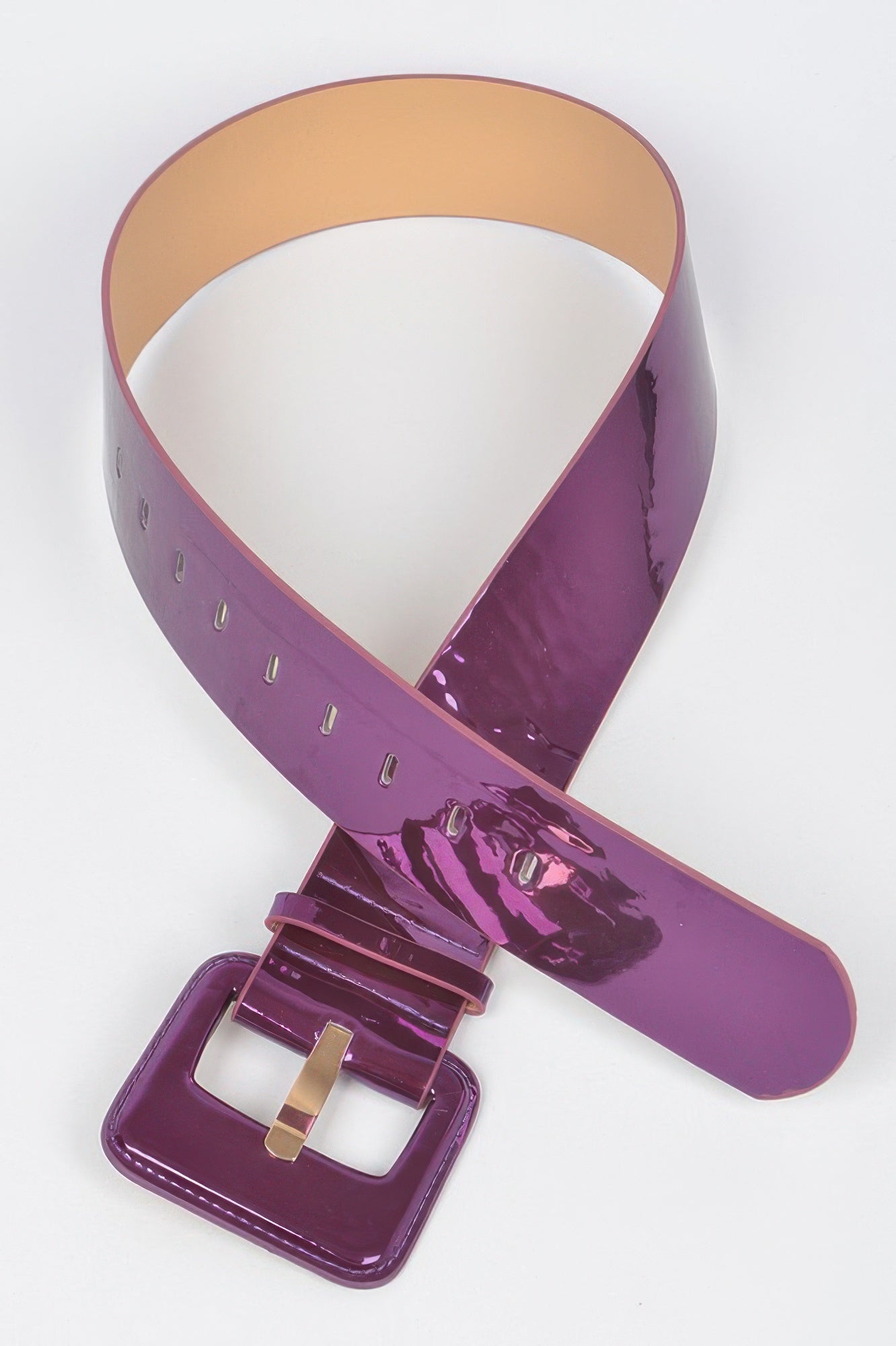 Metallic wide belt from Toshe Women's Fashions, showcasing a shiny, stylish accessory with a smooth buckle and metallic finish.