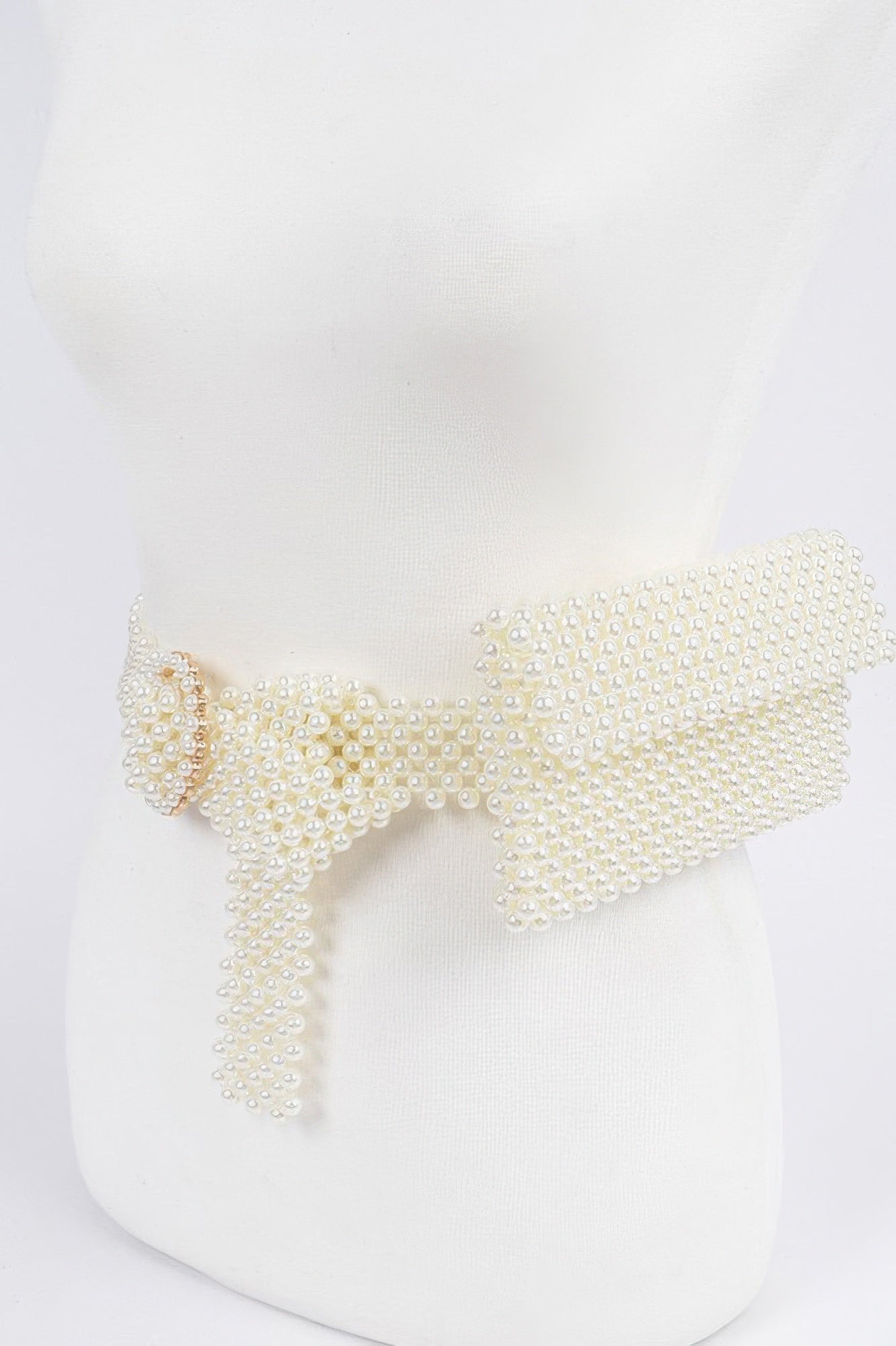Handmade faux pearl belt bag with stylish design, featuring a sleek strap and elegant pearl details, by Toshe Women's Fashions.