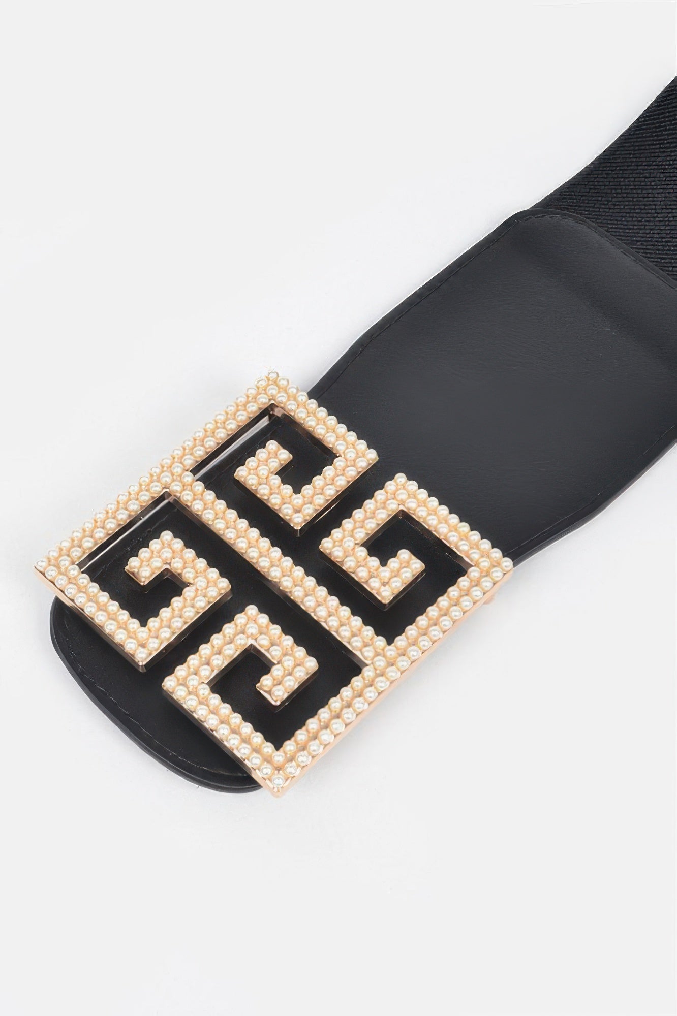Faux pearl buckle stretch belt from Toshe Women's Fashions, featuring a stylish pearl buckle and elastic design for comfortable wear.
