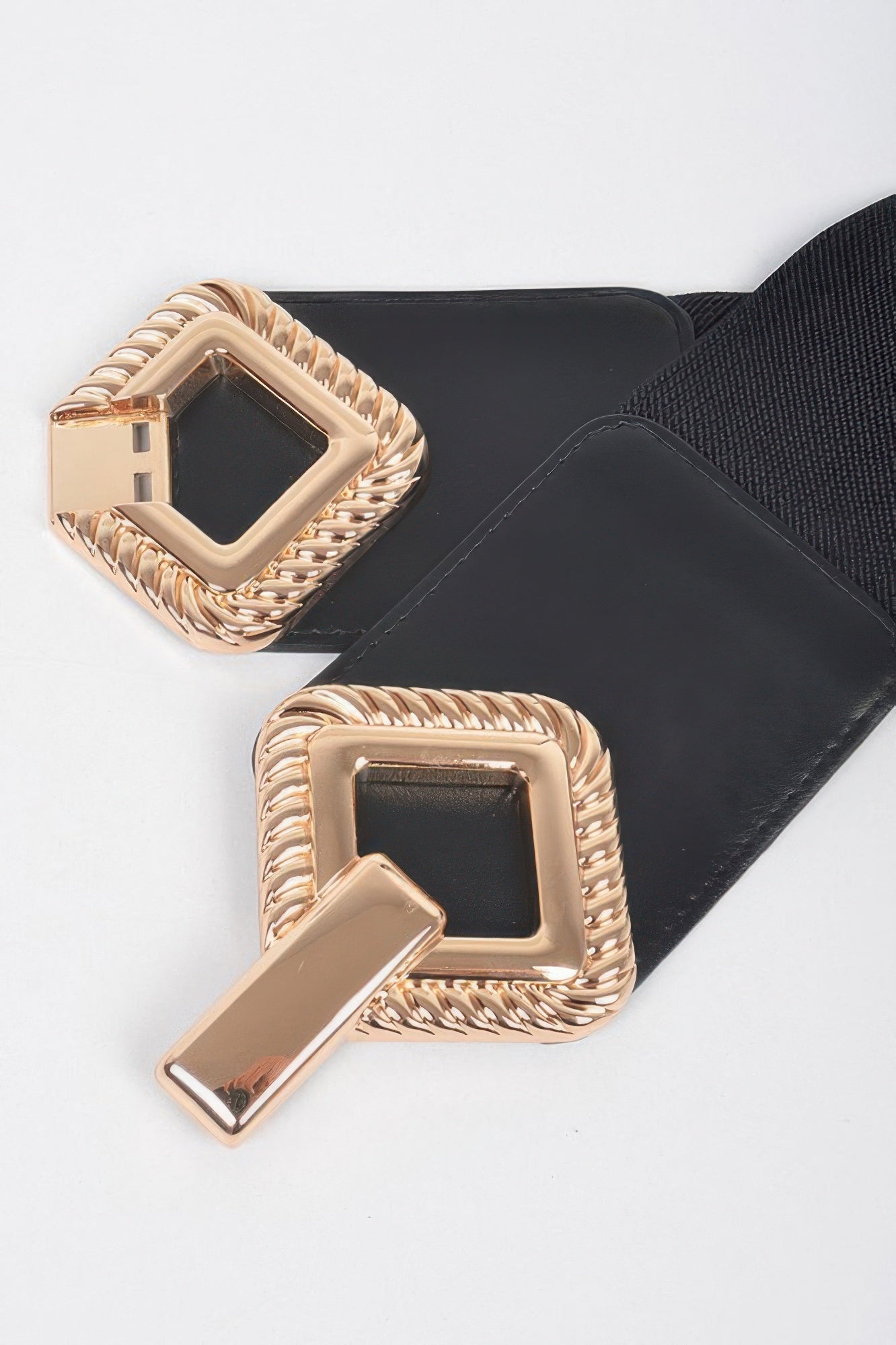 Big metal buckle stretch belt from Toshe Women's Fashions with a sleek design and adjustable fit, ideal for casual or dressy outfits.