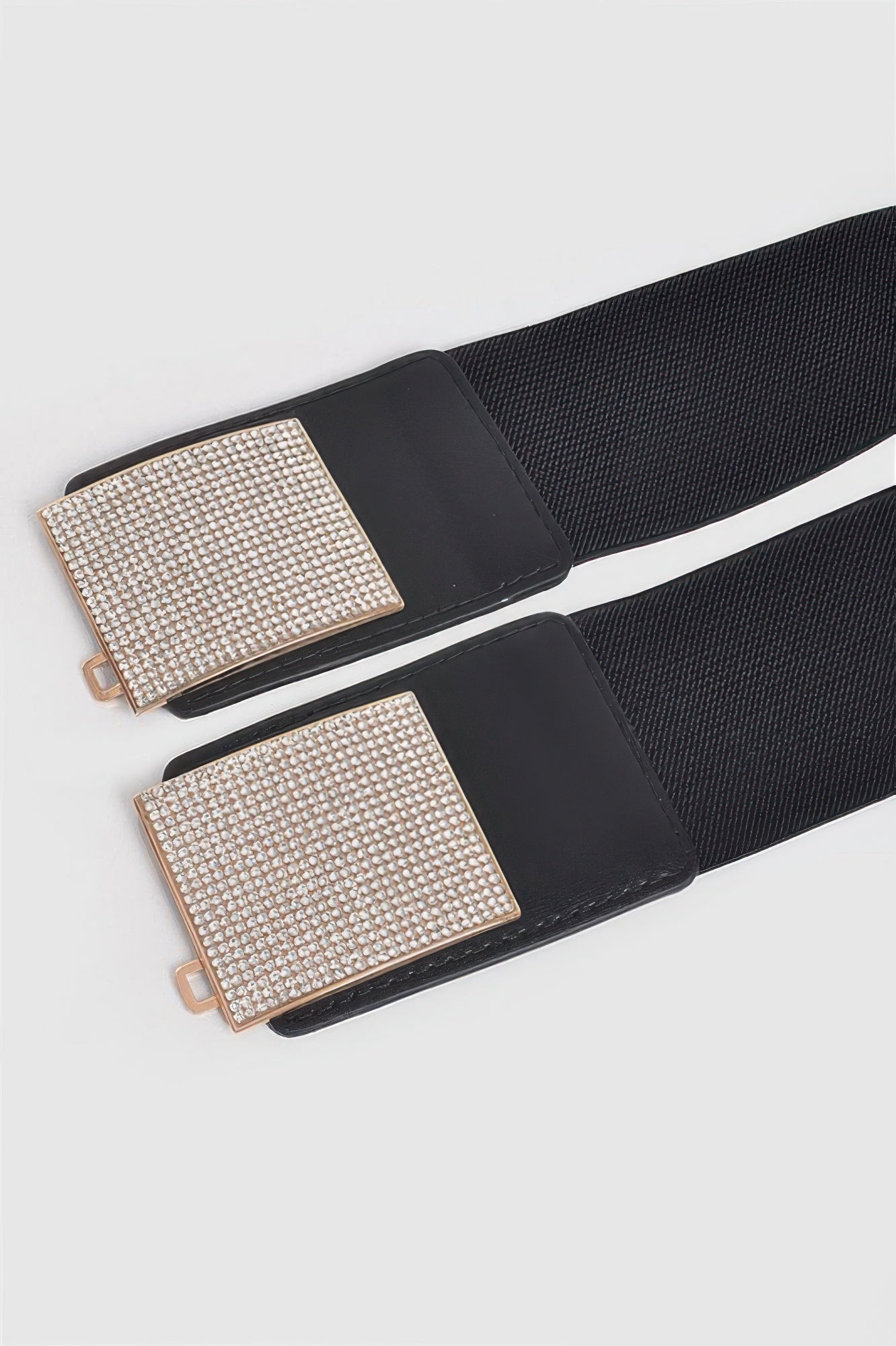 Rhinestone metal buckle stretch belt from Toshe Women's Fashions, featuring a sparkling rhinestone buckle and elastic strap.
