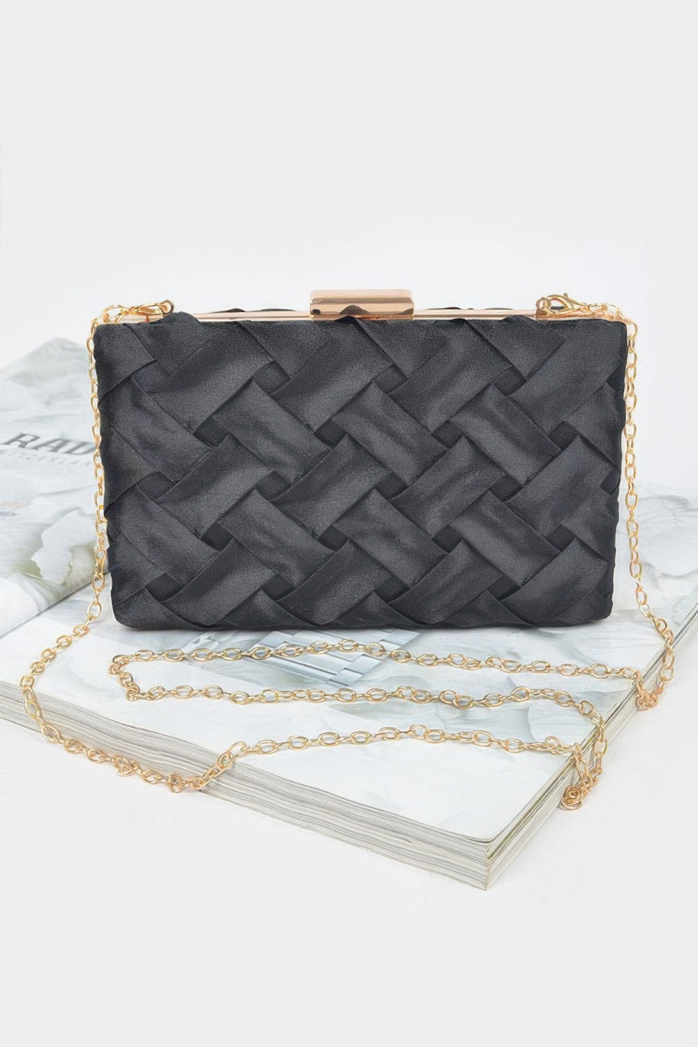 Cross hatched chain clutch bag by Toshe Women's Fashions, featuring a textured surface and gold-tone chain strap.
