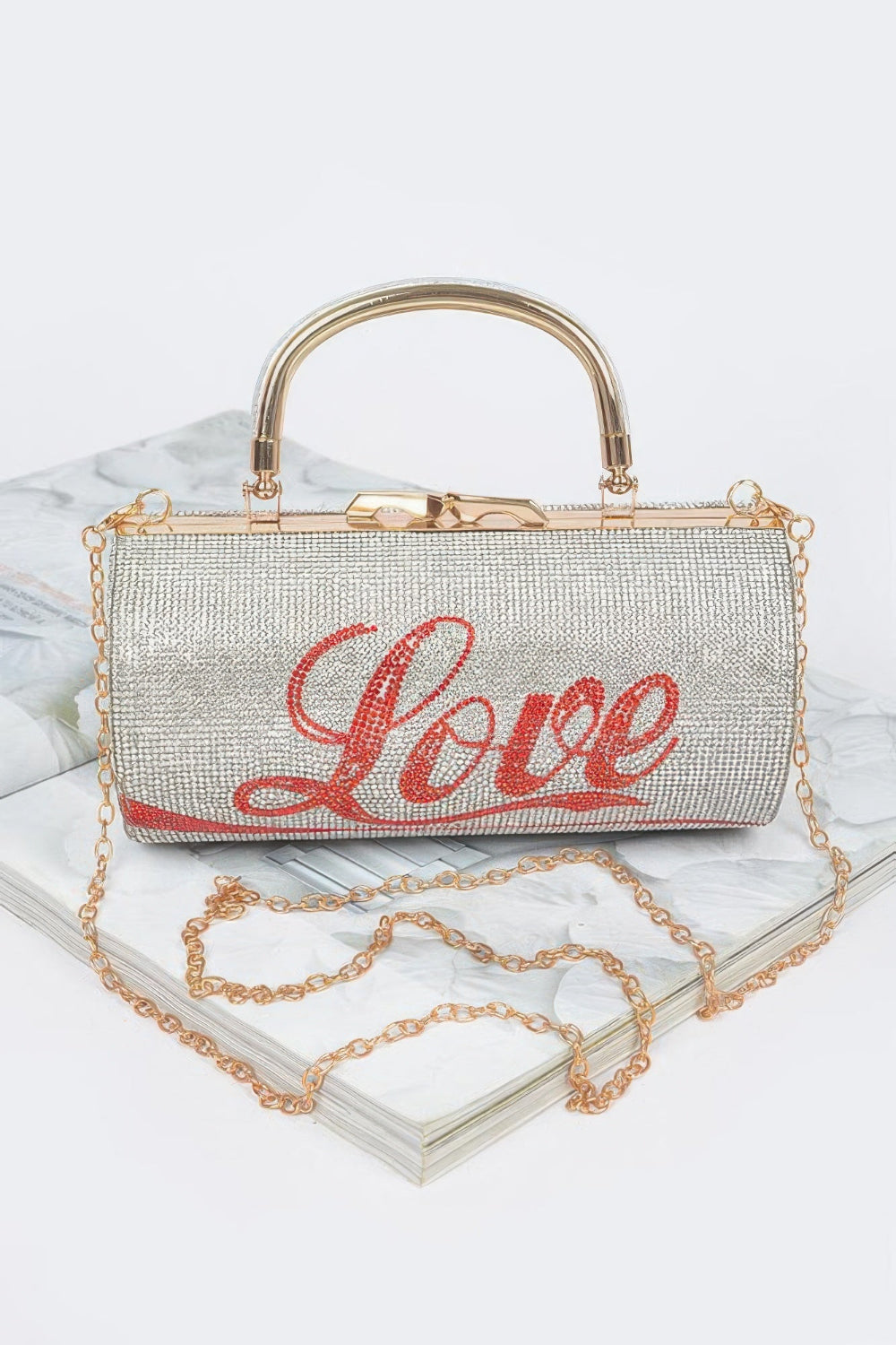 Rhinestone Love Party Clutch by Toshe Women's Fashions featuring sparkling rhinestones and a stylish clutch design.