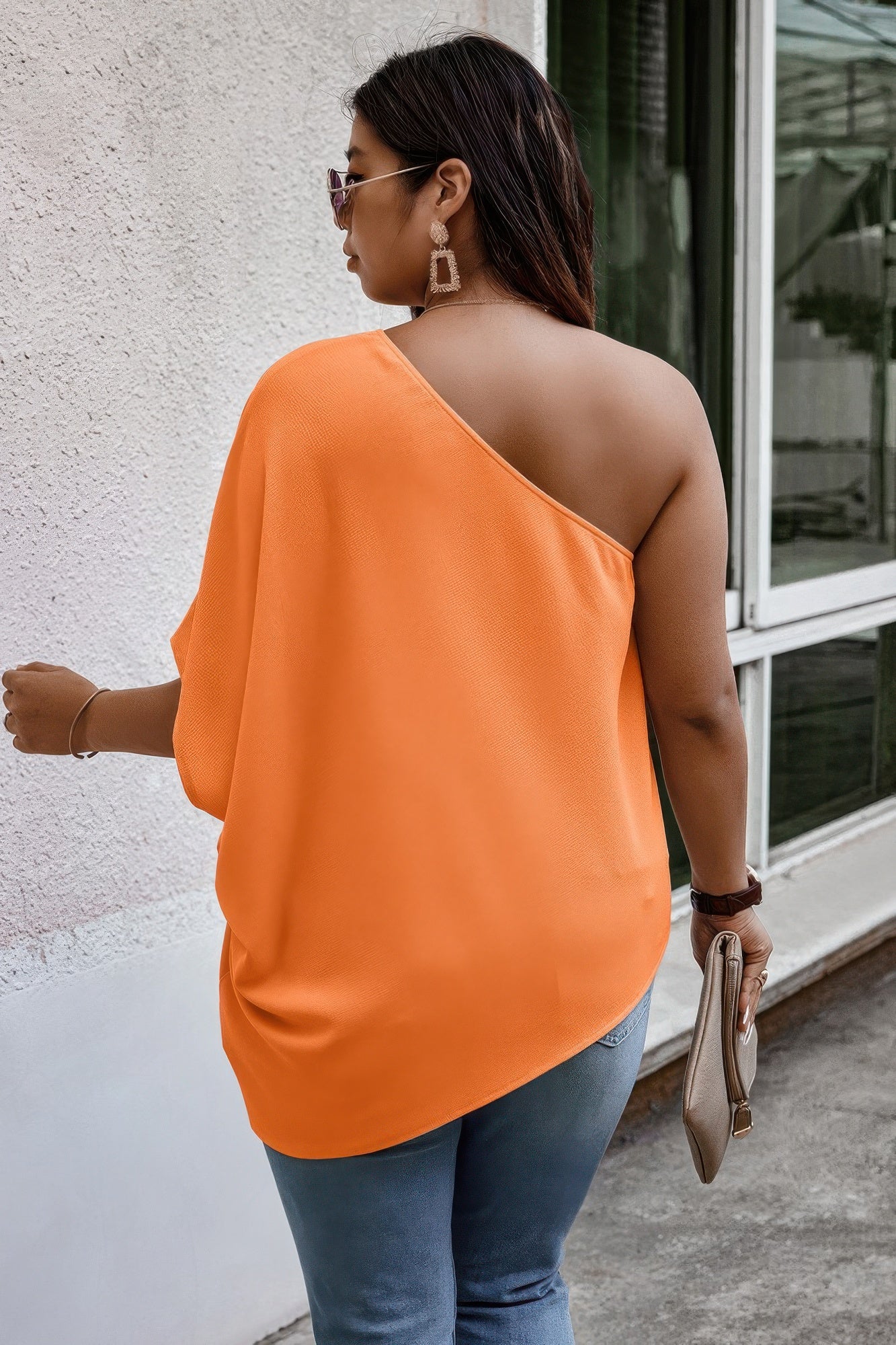 Loose fit one-shoulder shirt by Toshe Women's Fashions, featuring a relaxed style and casual fit, shown in a neutral fabric.