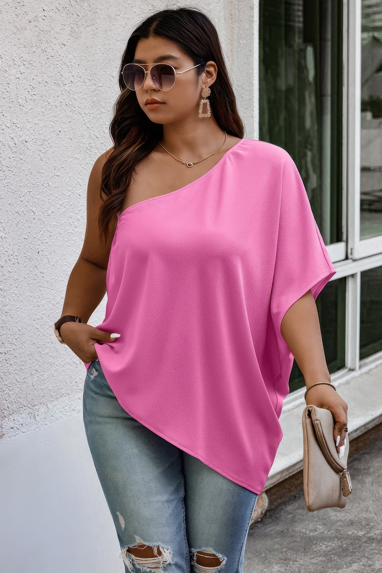 Loose fit one shoulder shirt by Toshe Women's Fashions, shown in a relaxed, draped style with soft fabric and casual design.