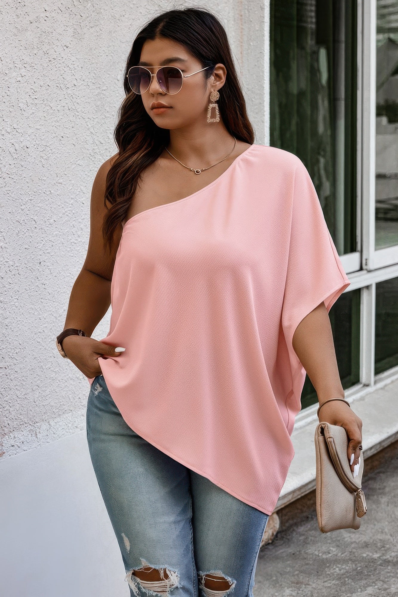Loose fit one shoulder shirt from Toshe Women's Fashions, featuring a stylish and relaxed design in soft fabric.