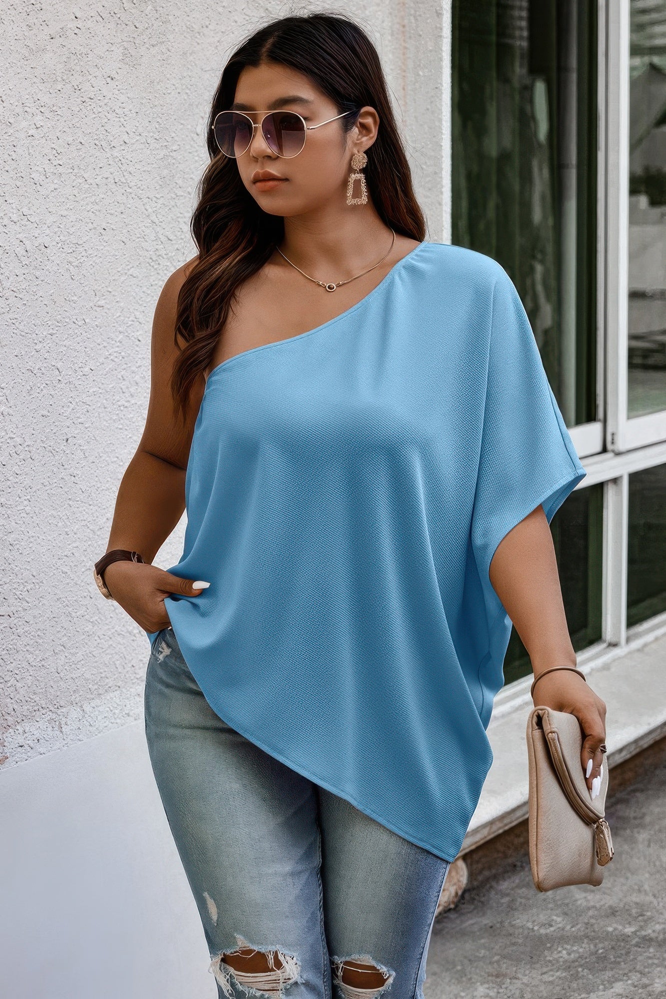 Loose fit one-shoulder shirt from Toshe Women's Fashions, featuring a casual, relaxed style in soft fabric.