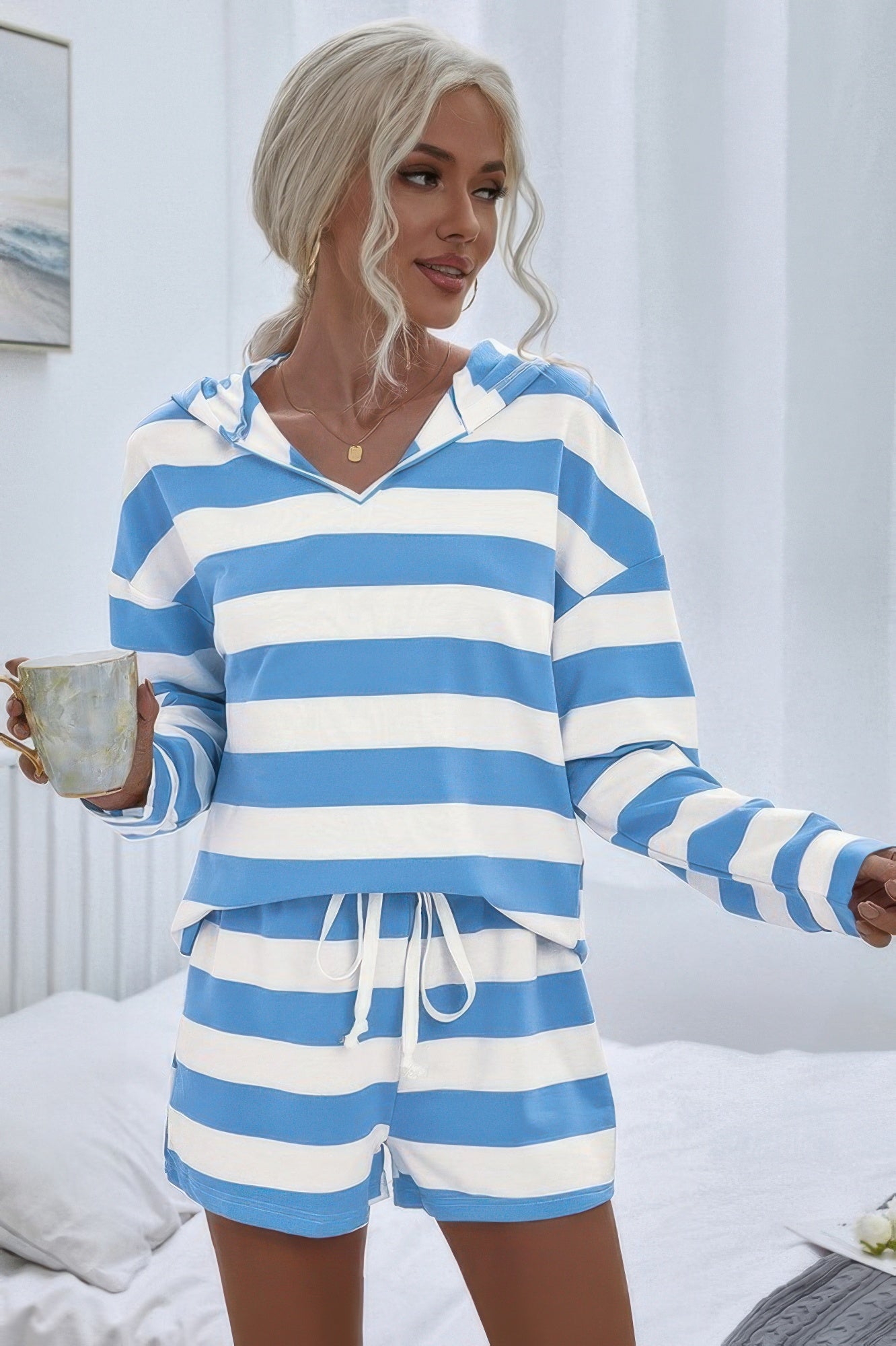 Oversized hooded striped pajama shorts set by Toshe Women's Fashions, featuring a cozy hood and relaxed fit in soft fabric.