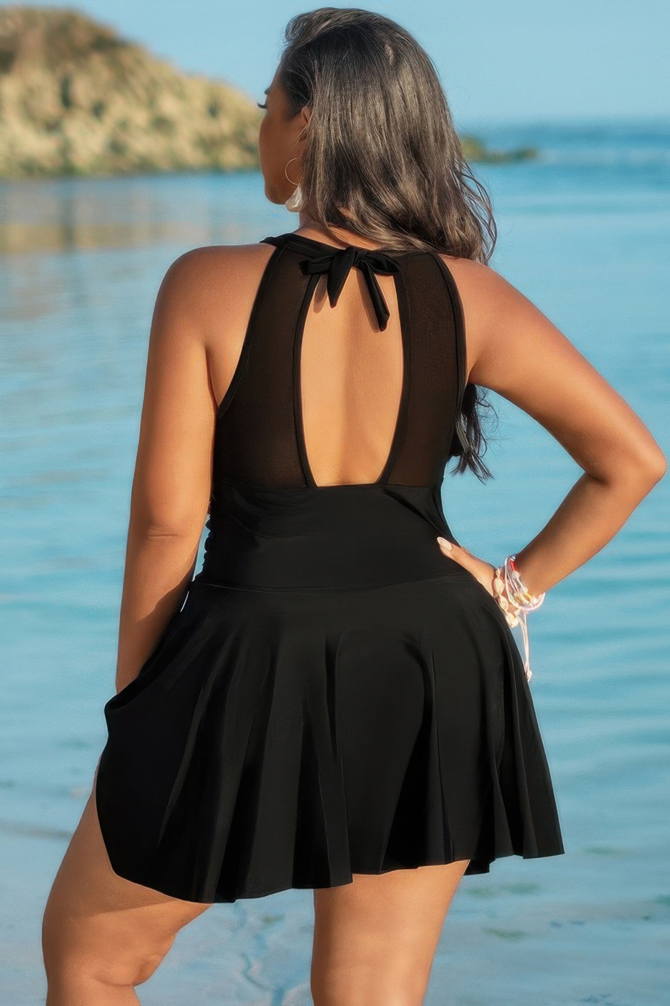 Toshe Women's Fashions halter ruched sleeveless swim dress with fitted bodice and stylish design, perfect for beach or poolside.
