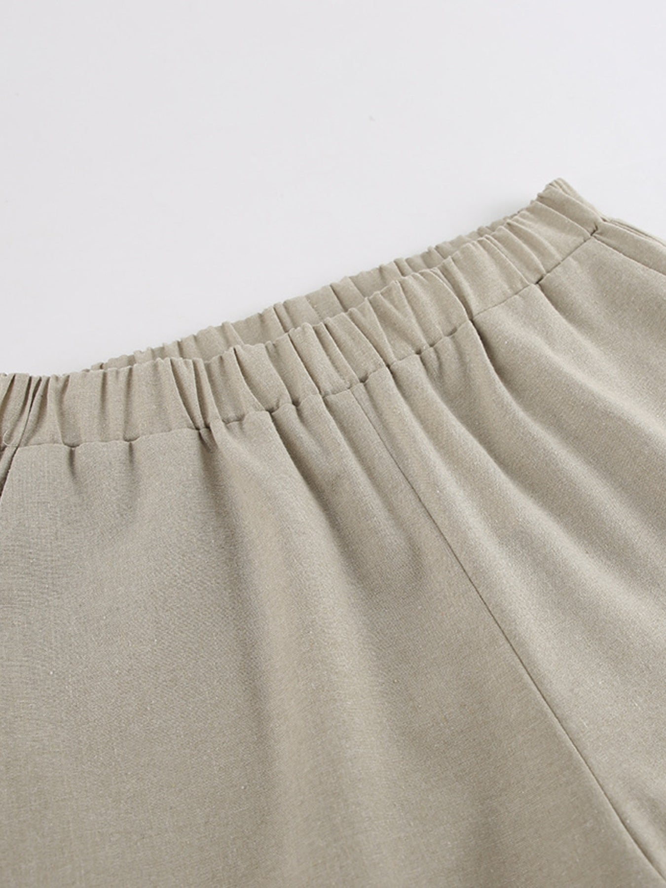 Trendsi cutout tank top paired with wide-leg pants set, featuring a stylish sleeveless top and flowy high-waisted pants.
