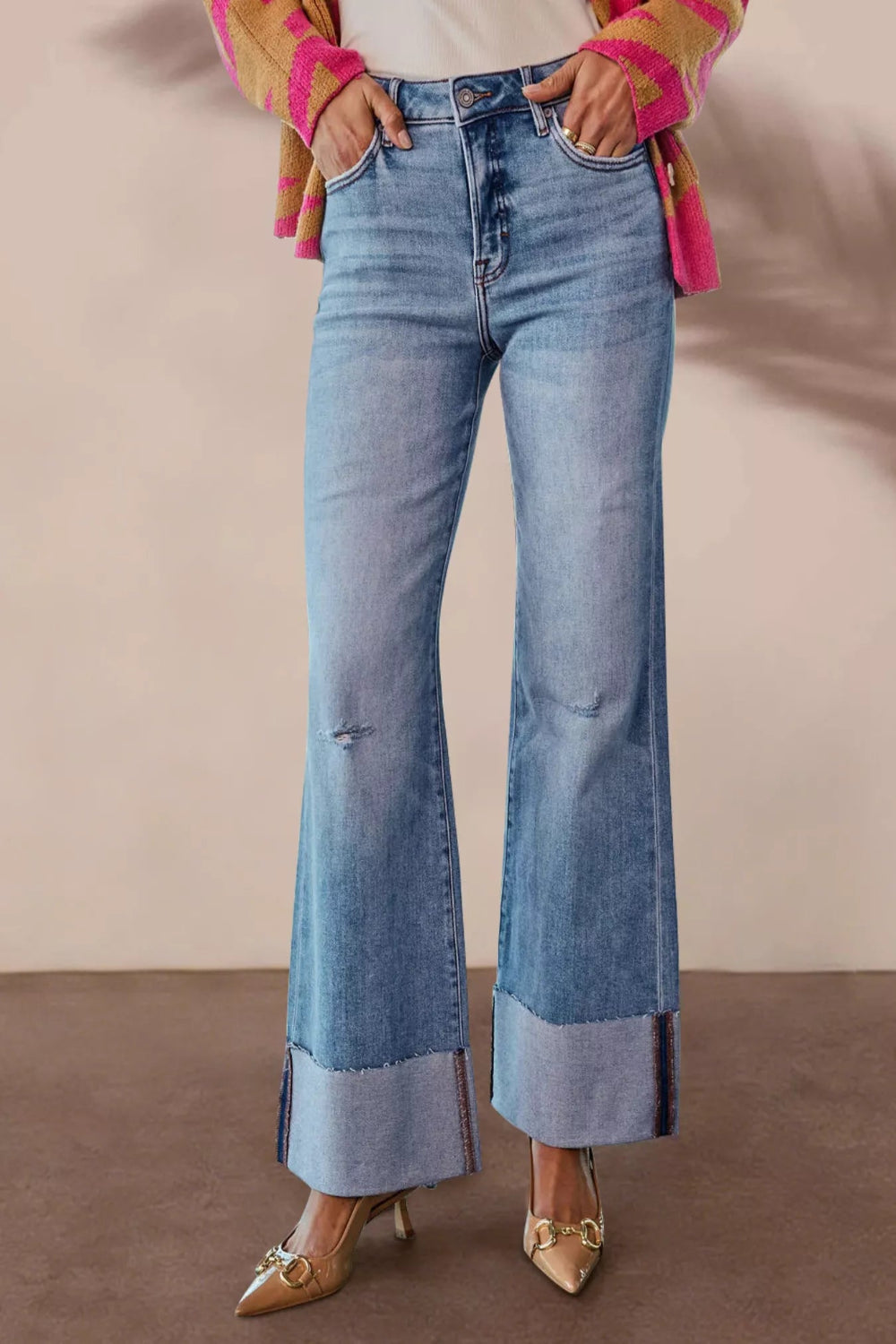 Distressed high-waisted flare jeans in denim, featuring a vintage wash, from Trendsi, with a fitted waist and wide flare leg.