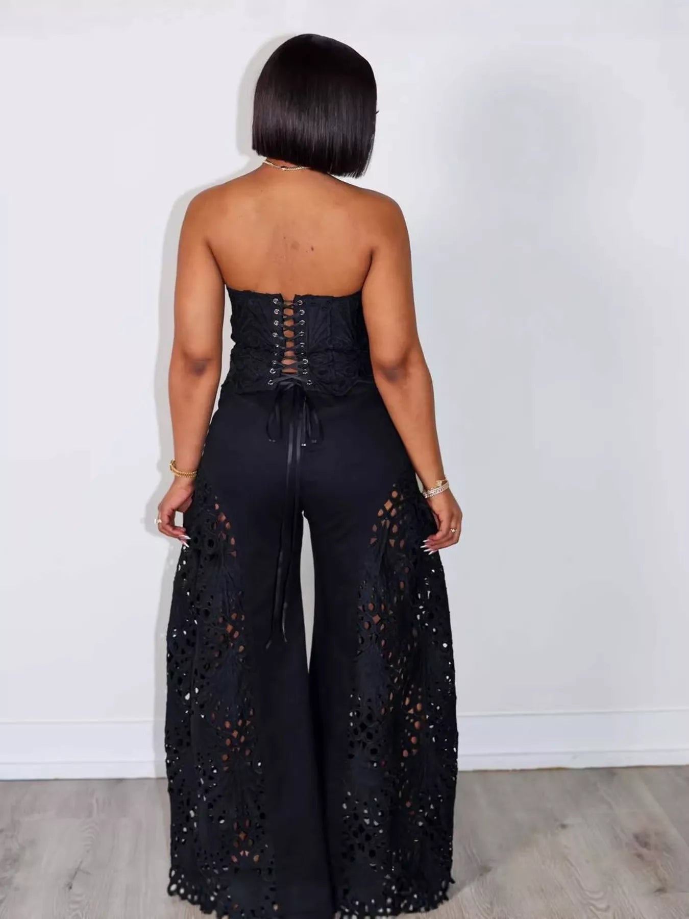 Trendsi cutout tube top and wide-leg pants matching set, stylish two-piece outfit with cutout details and flowy pants.