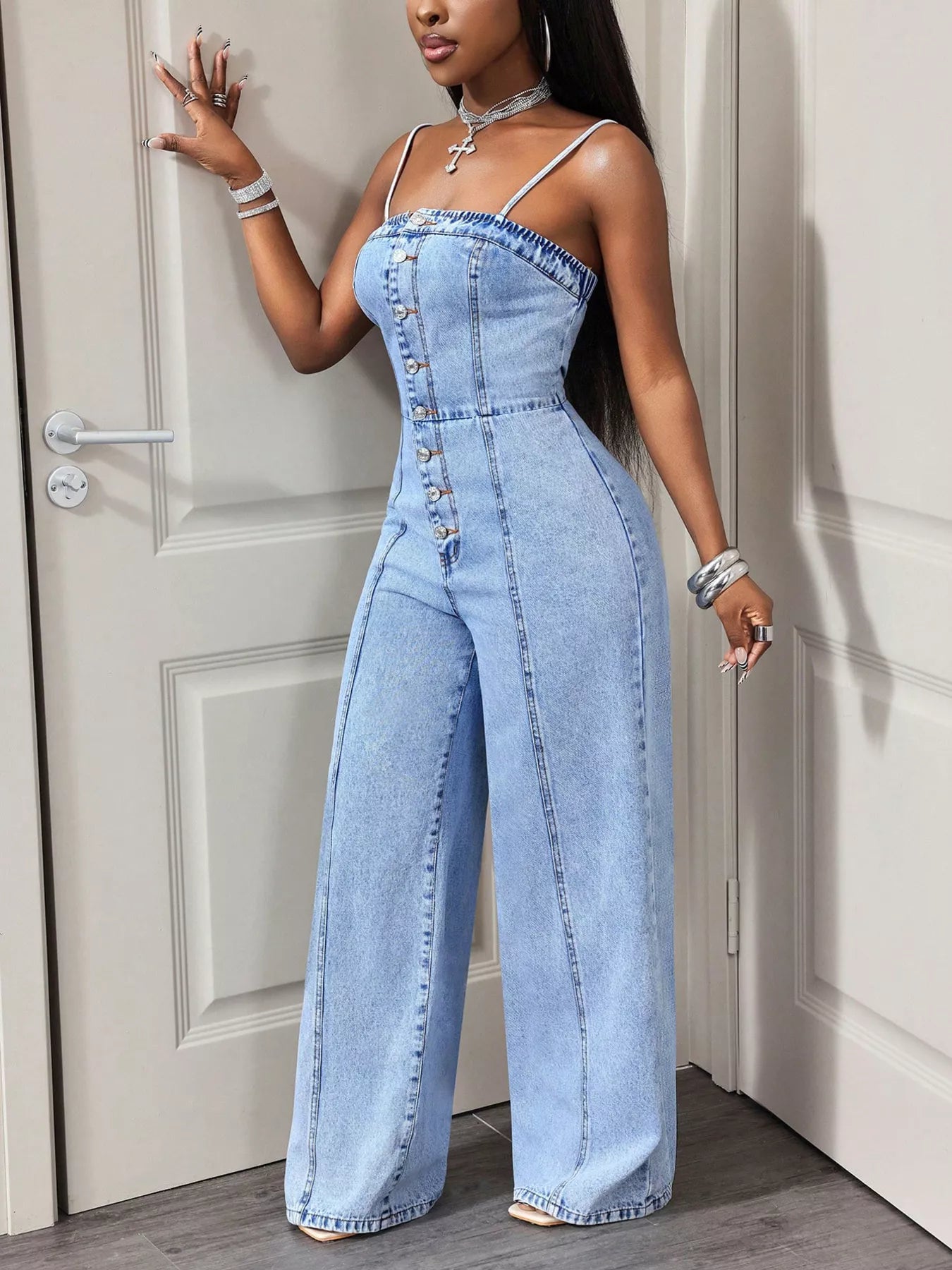 Wide-leg denim jumpsuit by Trendsi featuring a button-down front and casual, stylish design.