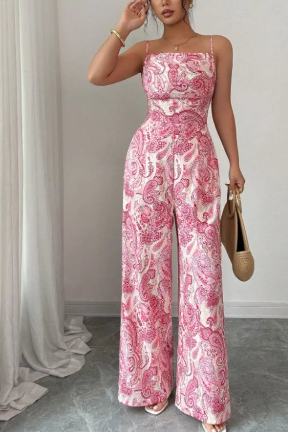 Pink Paisley wide-leg jumpsuit from Trendsi, featuring a flowy fit and stylish pattern, shown on a model.