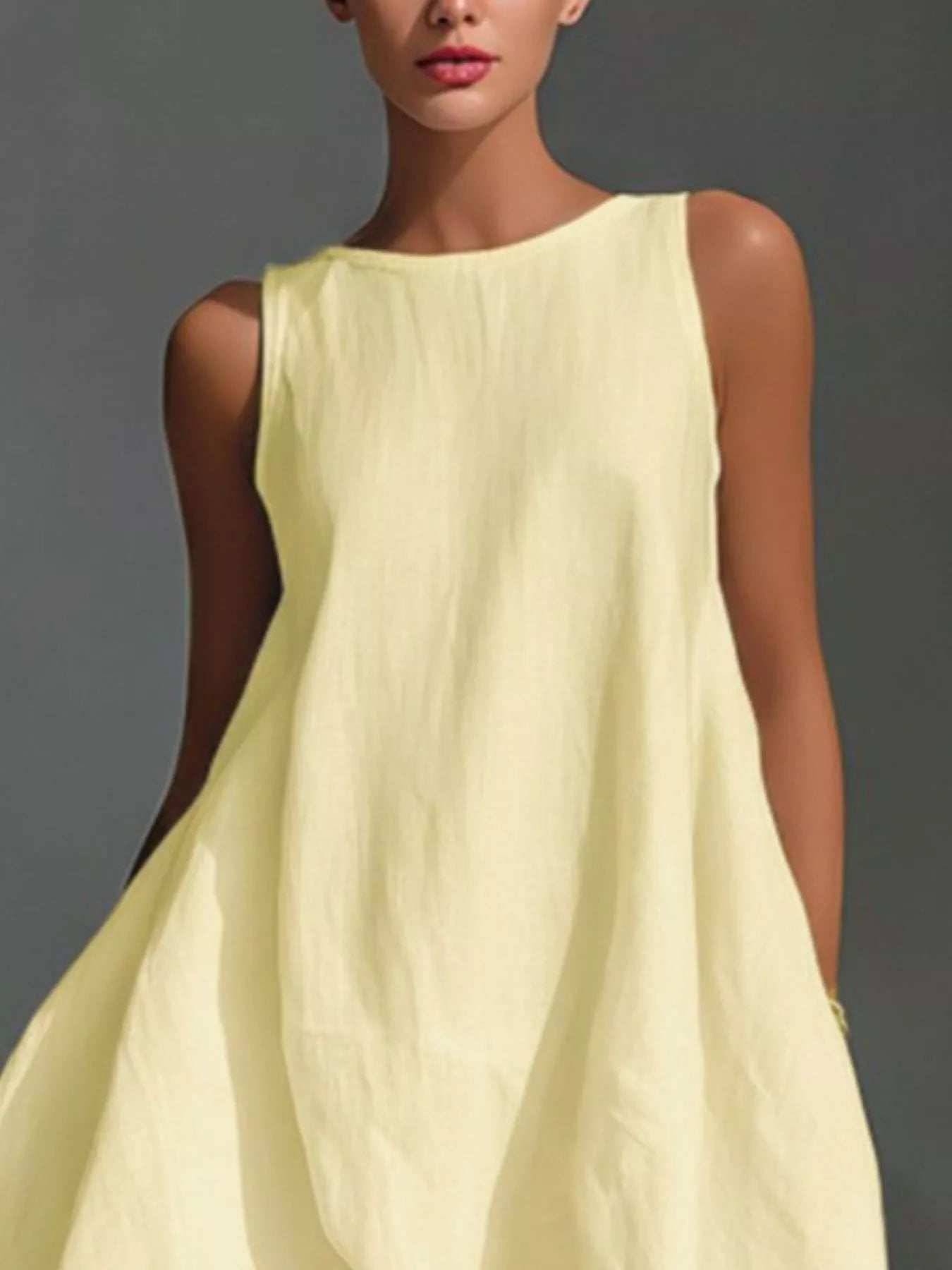 High-low sleeveless dress with round neckline from Trendsi, featuring a stylish, flowing design perfect for warm weather.