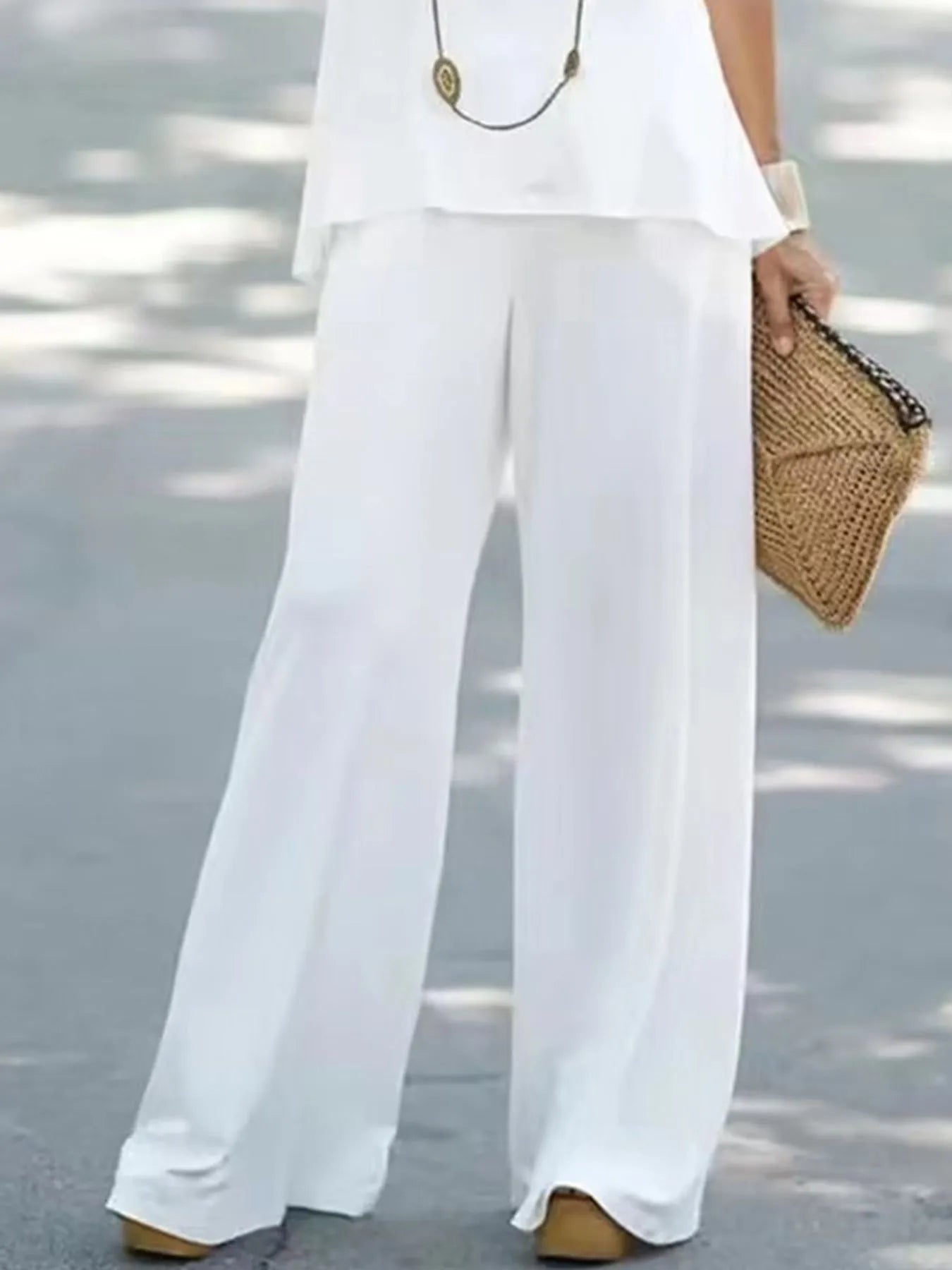 Trendsi halter top and wide-leg pants set, featuring a stylish halter neckline and flowing wide-leg design, in a fashionable fabric.
