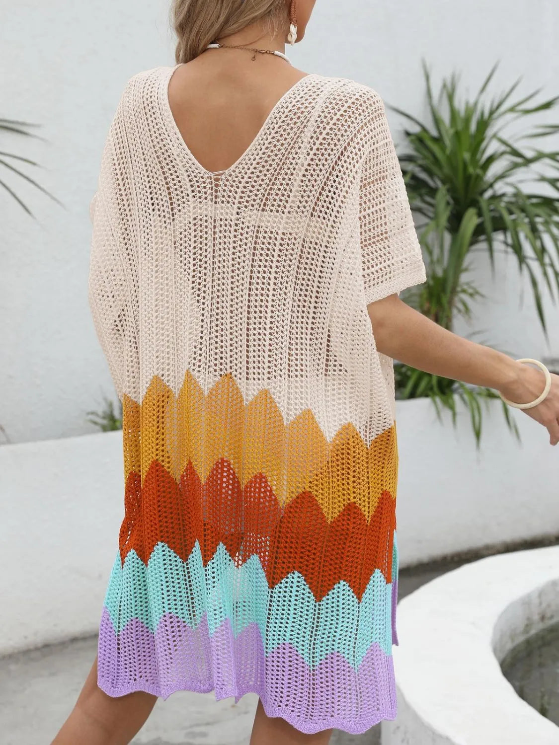 Openwork V-neck half sleeve swim cover-up by Trendsi featuring a lightweight, stylish design ideal for beach or poolside wear.