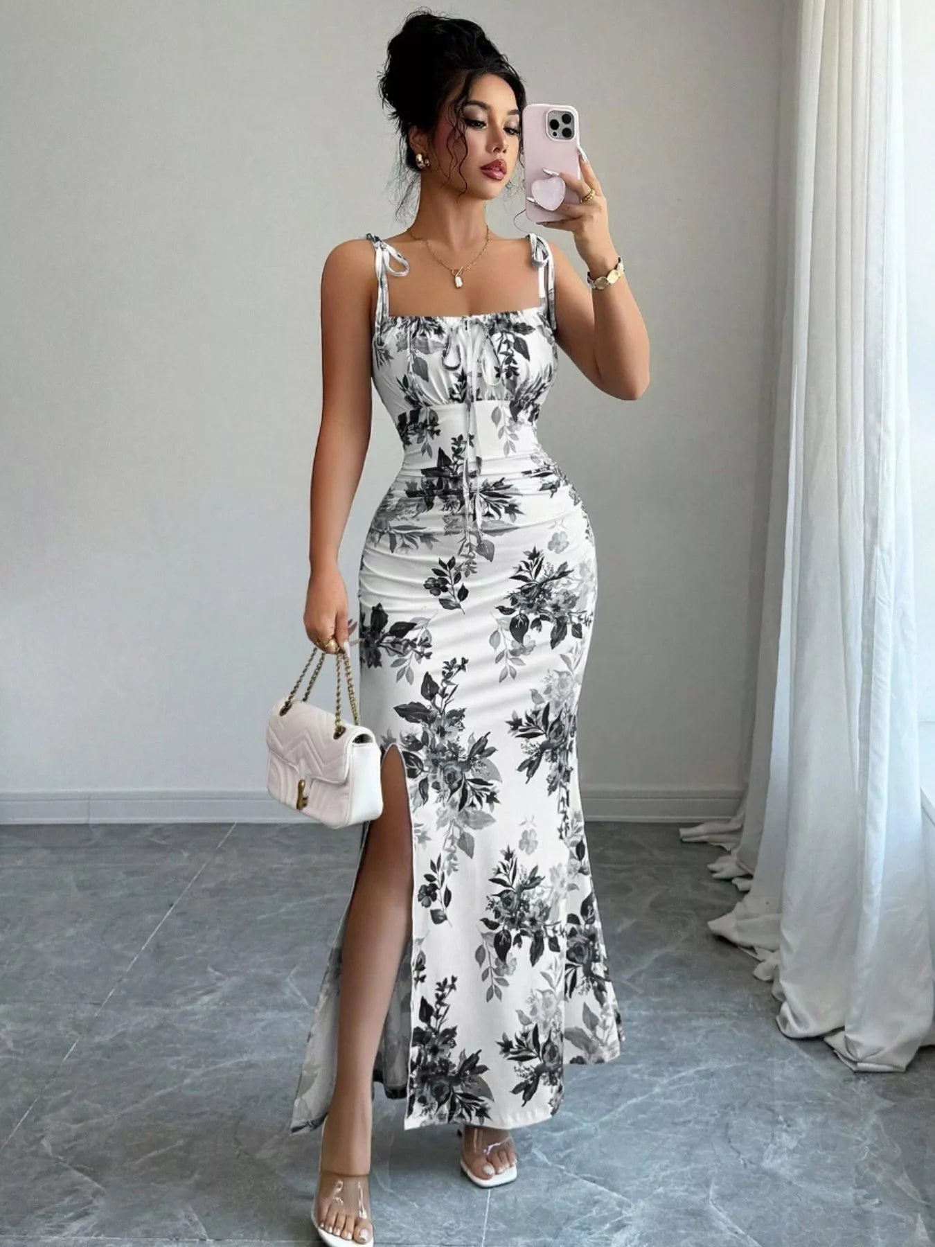 Printed tie-strap slit maxi dress from Trendsi featuring a flowy silhouette and bold pattern, perfect for summer occasions.