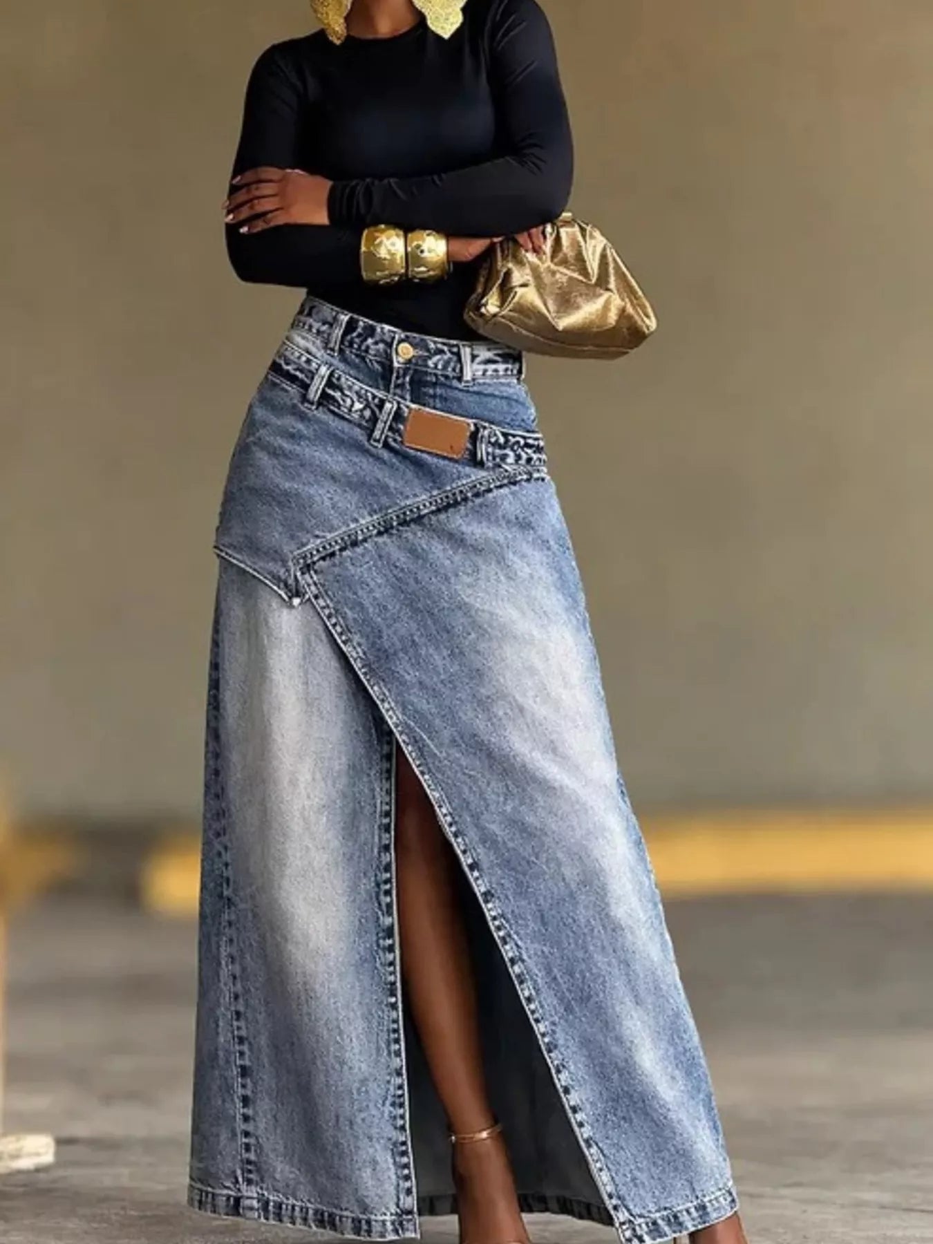 High-waisted slit denim skirt by Trendsi, showing a stylish blue denim skirt with a front slit and fitted waist, on a neutral background.