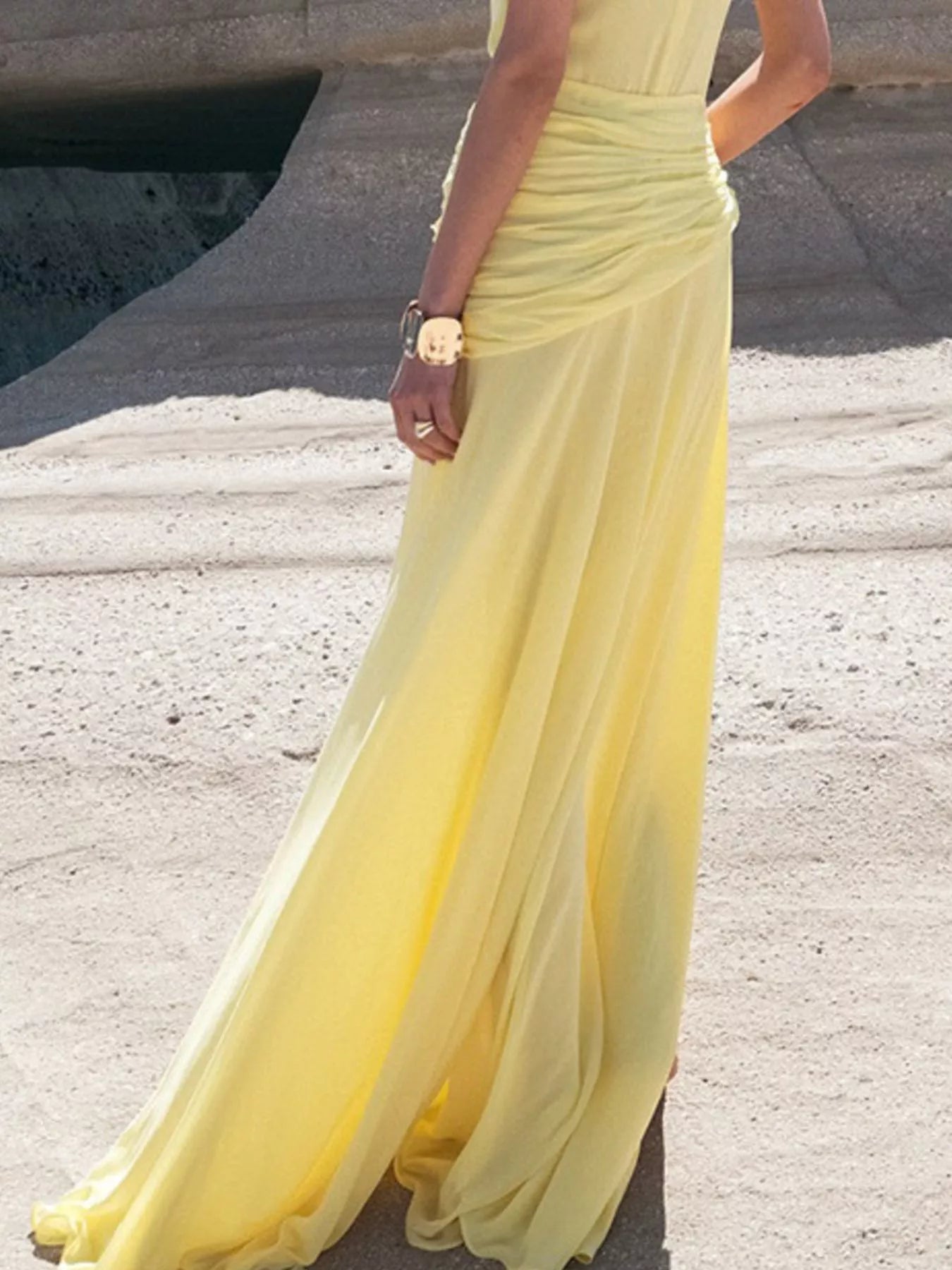 Yellow sleeveless ruched high-slit maxi dress by Trendsi, featuring a flowing fabric and elegant design perfect for summer occasions.